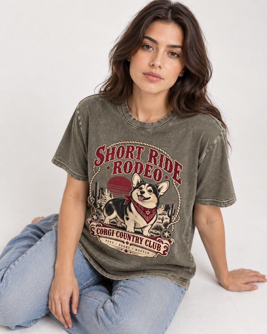 Corgi Short Ride Rodeo Country Club Badge Washed Tee in Army Green, worn by a seated model