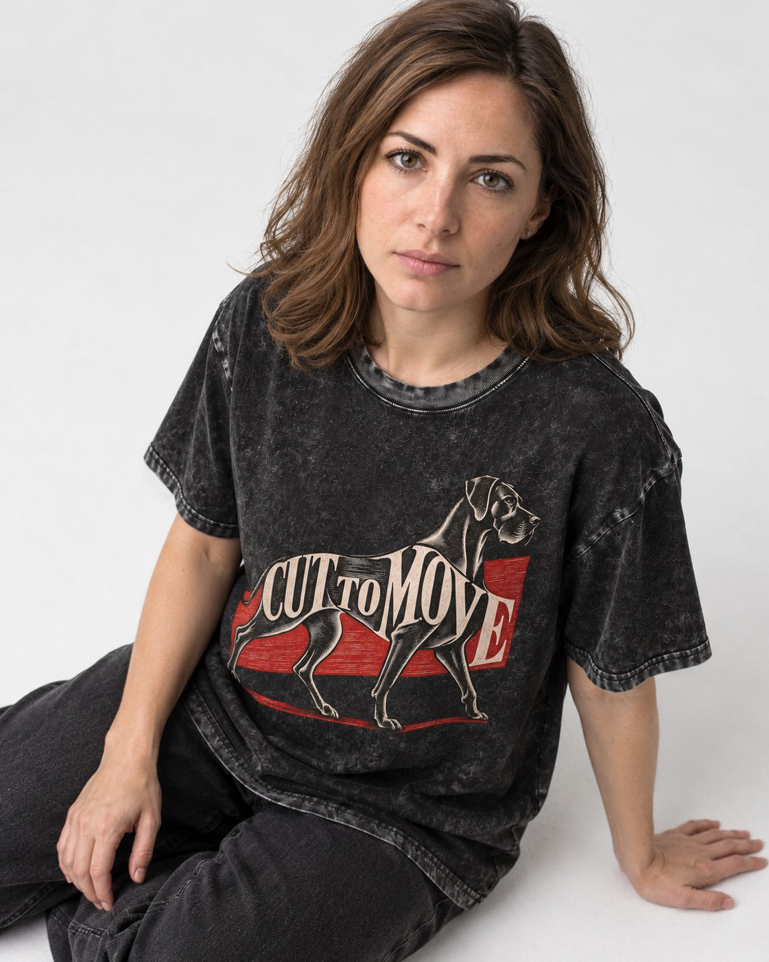 Great Dane Cut to Move Walking Typography Graphic Washed Tee in Black, worn by a seated model