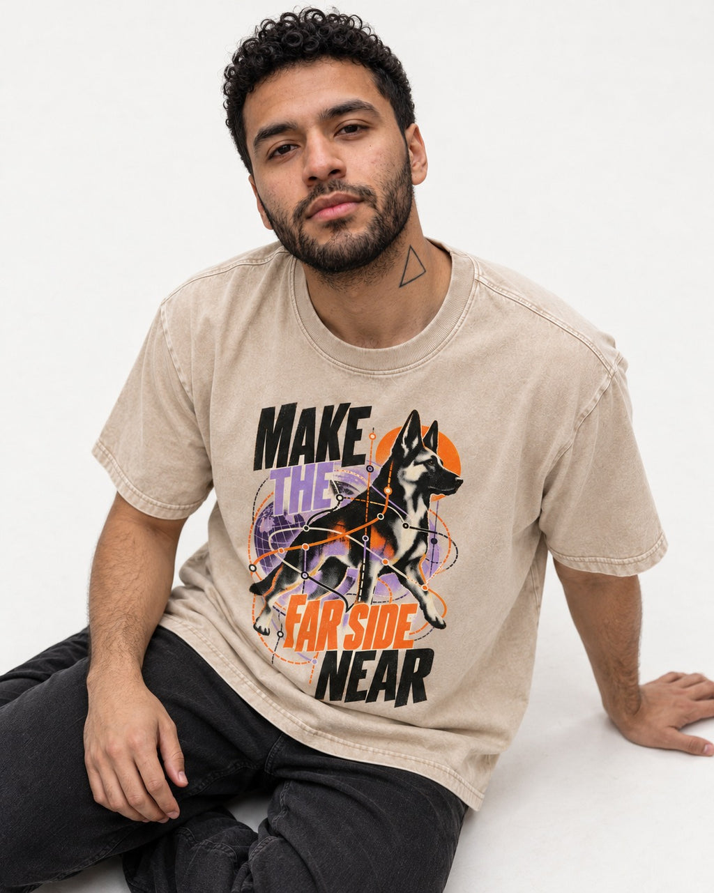 German Shepherd Dog Far Side Near Washed Tee in Apricot, worn by a seated model