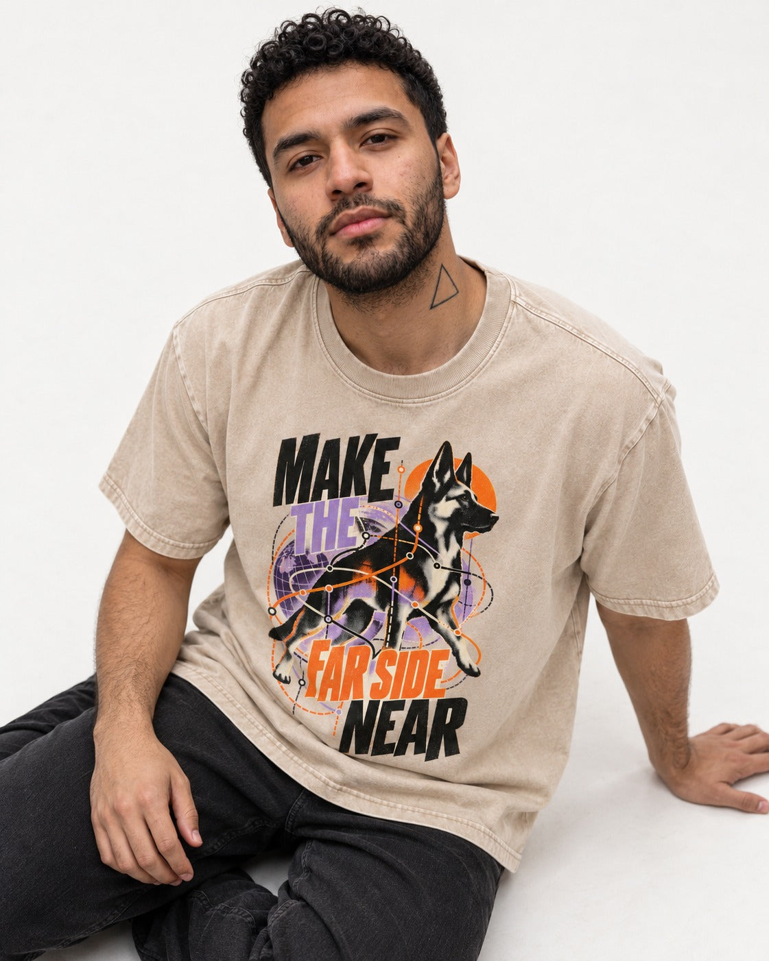 German Shepherd Dog Far Side Near Washed Tee in Apricot, worn by a seated model