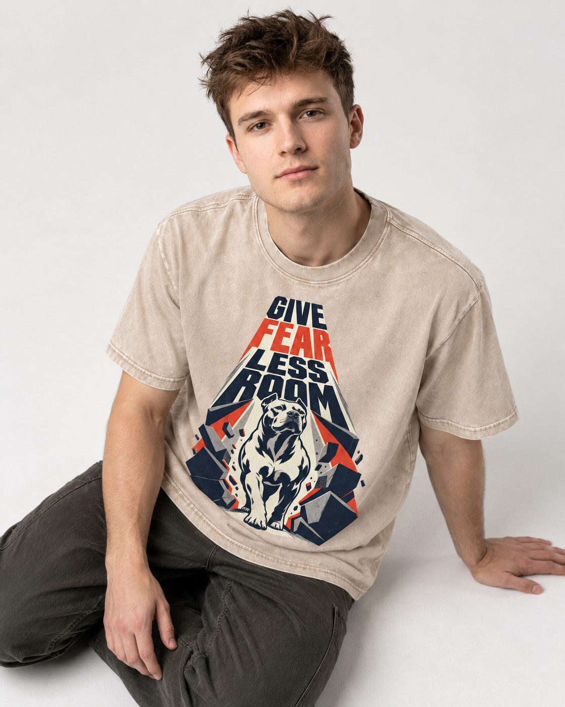 Pitbull Give Fear Less Room Breakthrough Graphic Washed Tee in Apricot, worn by a seated model