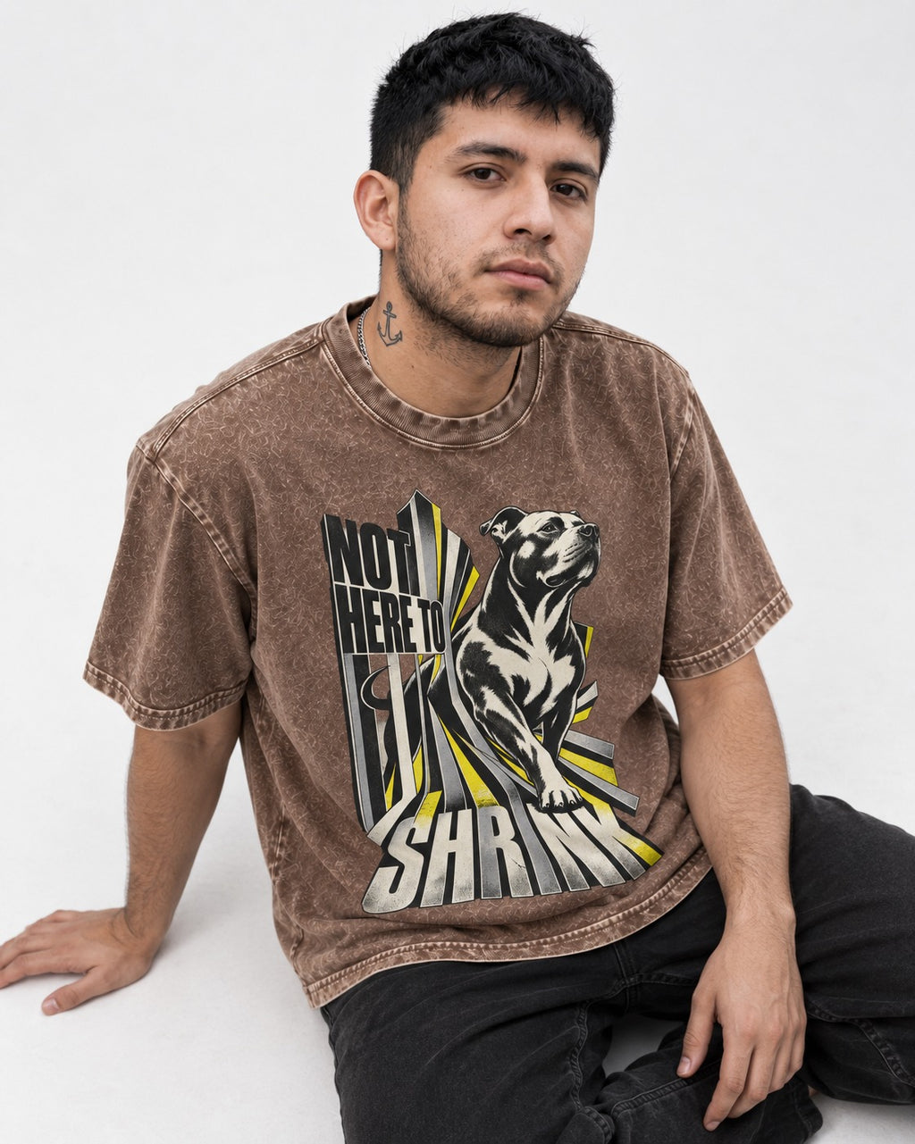 Not Here to Share Pitbull Washed Tee in Coffee, worn by a seated model