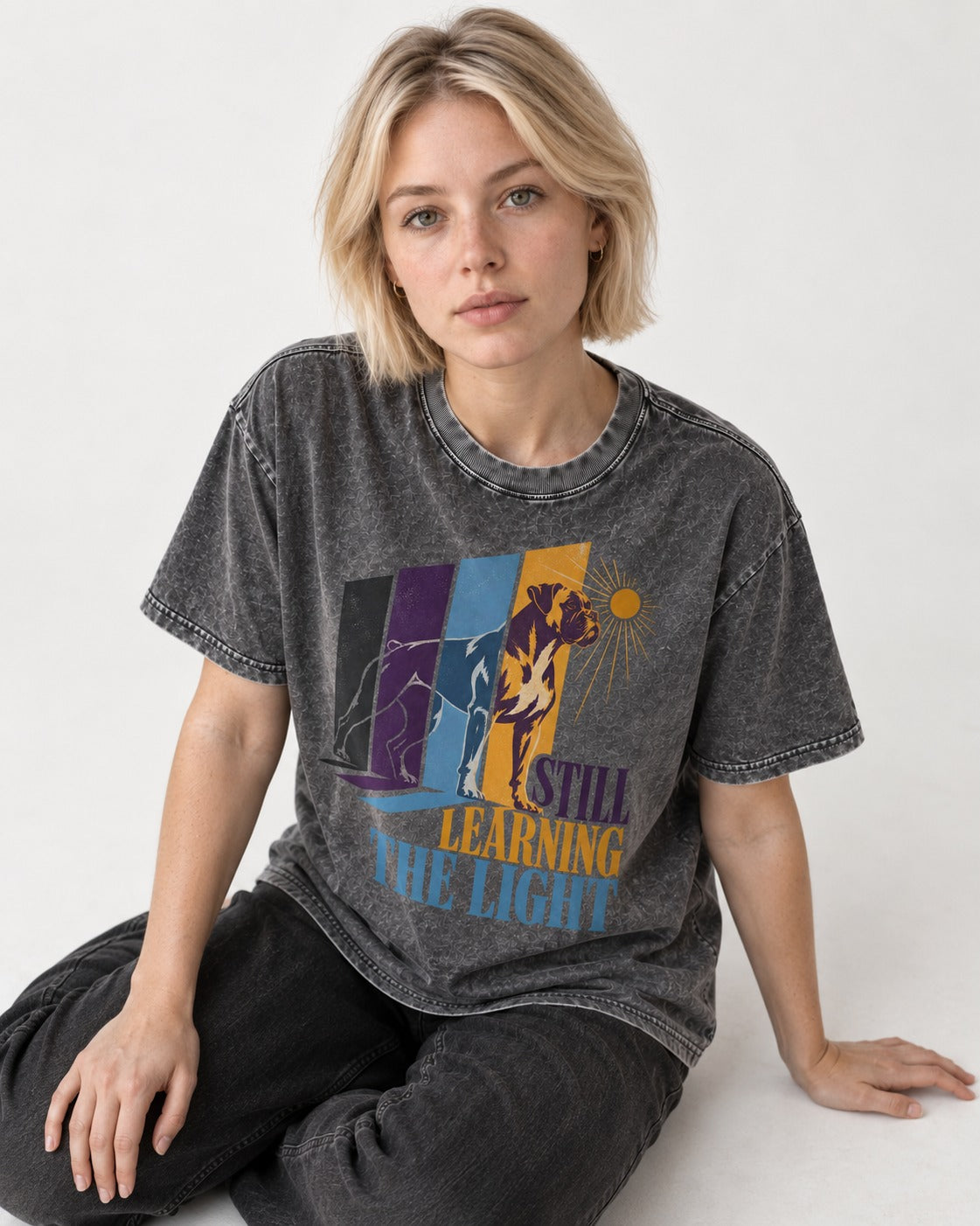 Still Learning the Light Boxer Doorway Progression Graphic Washed Tee in Gray, worn by a seated model