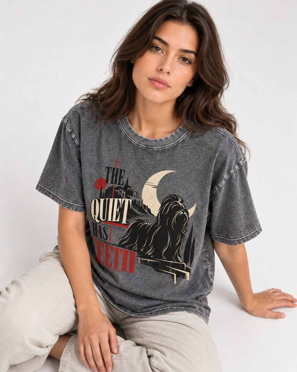 The Quiet Shih Tzu Has Teeth Washed Tee in Gray, worn by a seated model
