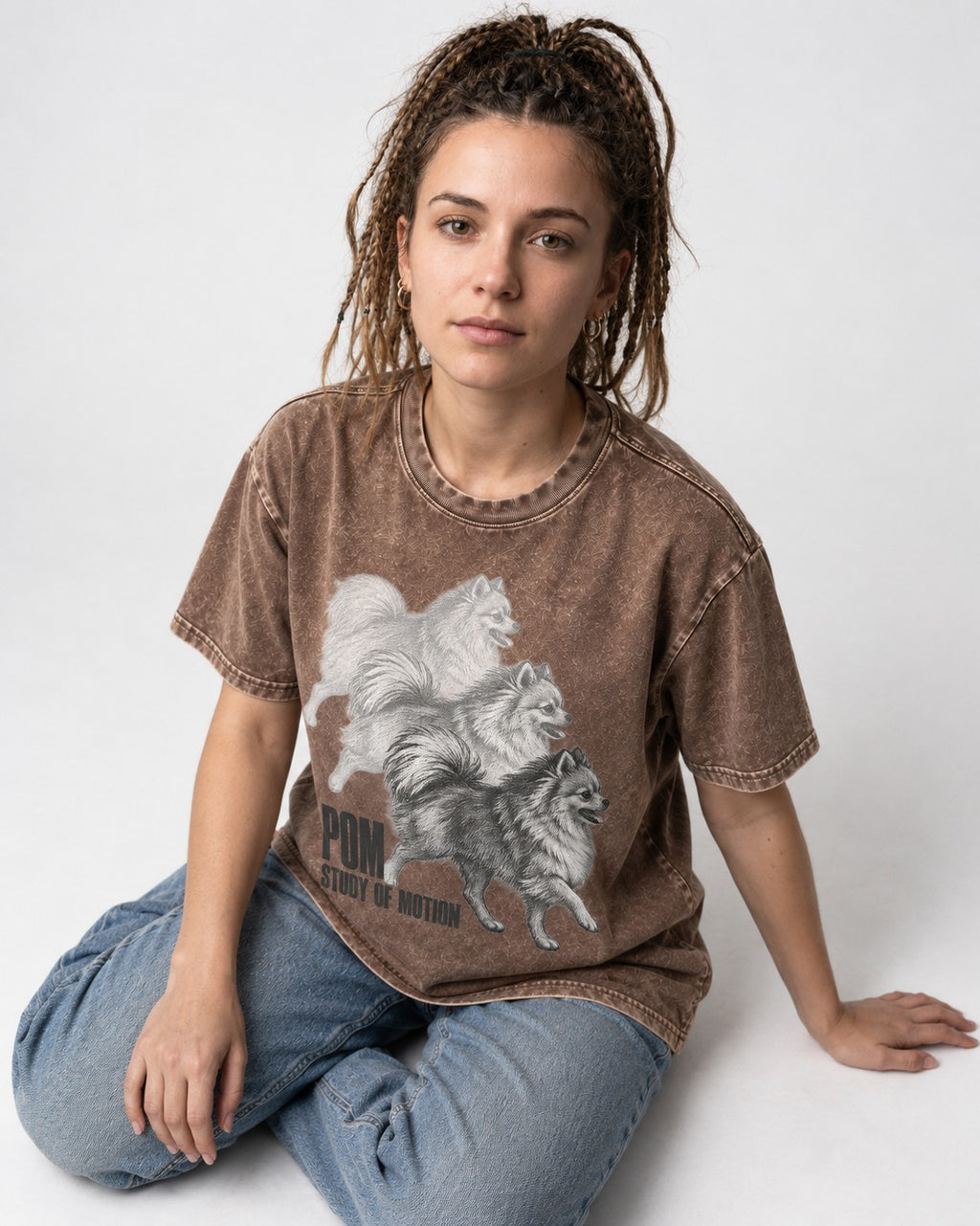 Pomeranian Study of Motion Washed Tee in Coffee, worn by a seated model