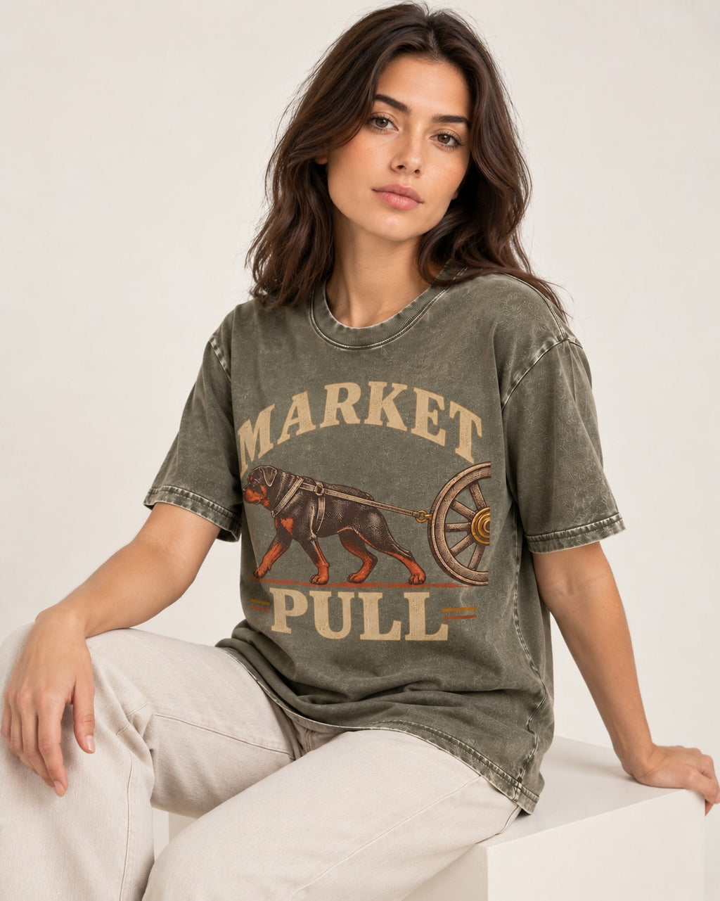 Market Pull Rottweiler Cart Harness Graphic Washed Tee in Army Green, worn by a seated model