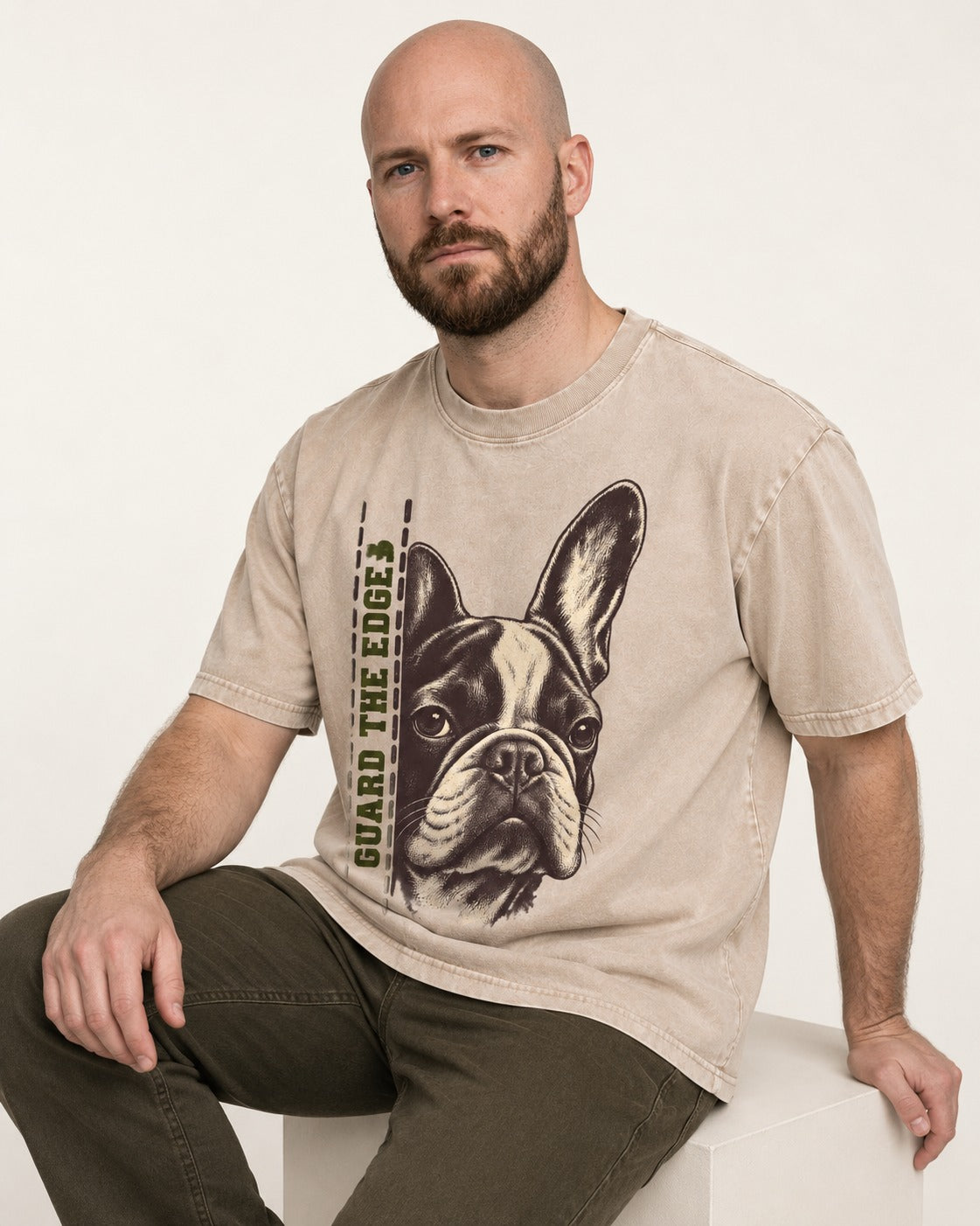 Frenchie Guard the Edge Washed Tee in Apricot, worn by a seated model