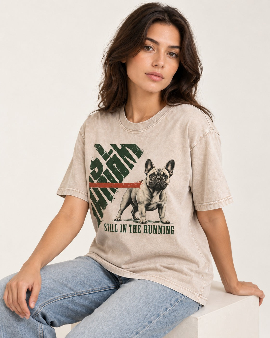 Frenchie Still in the Running Washed Tee in Apricot, worn by a seated model