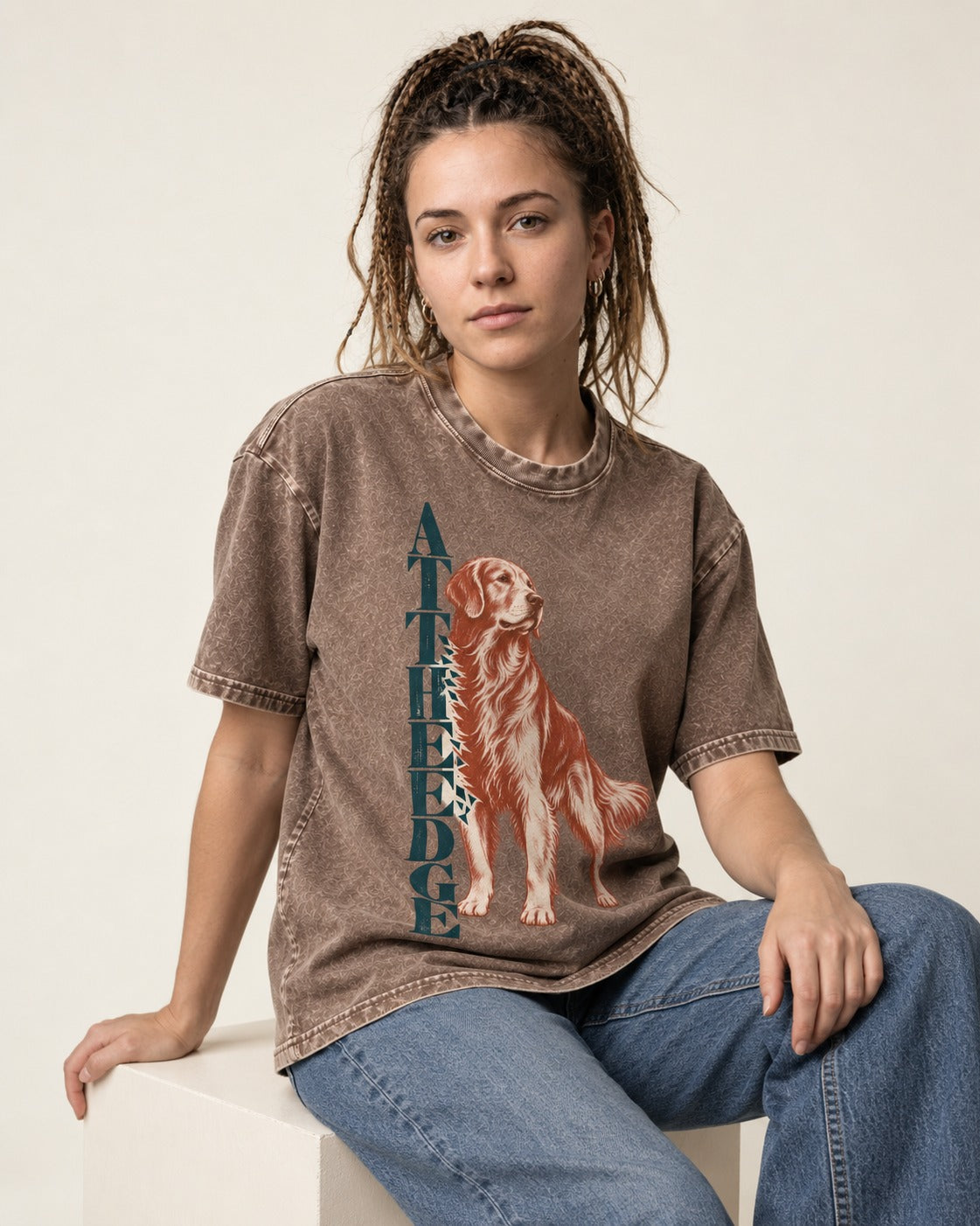 Golden Retriever At the Edge Washed Tee in Coffee, worn by a seated model