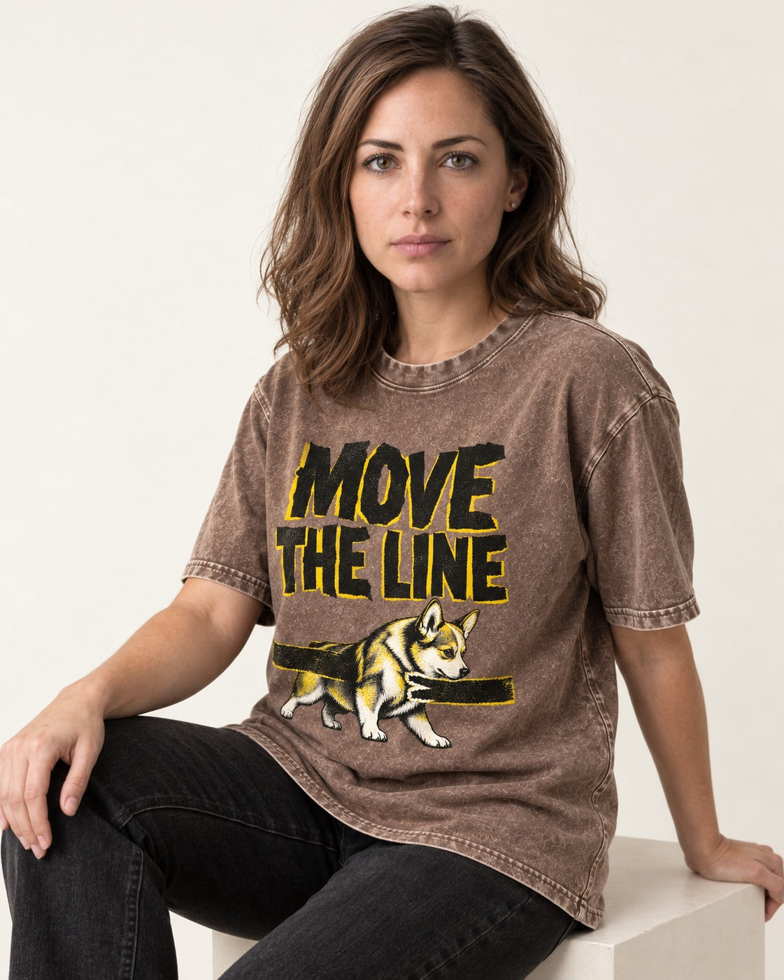 Corgi Move the Line Washed Tee in Coffee, worn by a seated model