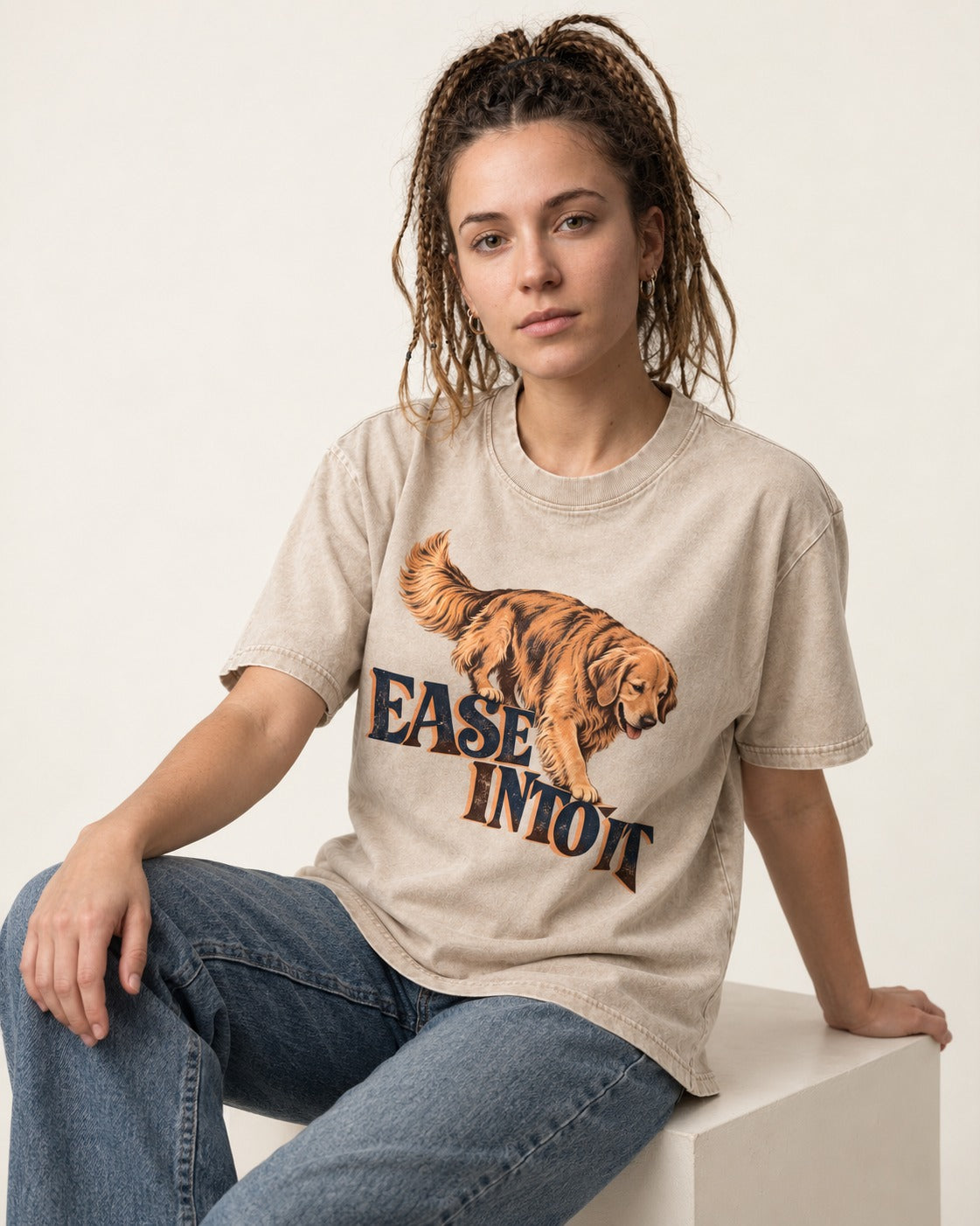 Golden Retriever Ease Into It Washed Tee in Apricot, worn by a seated model