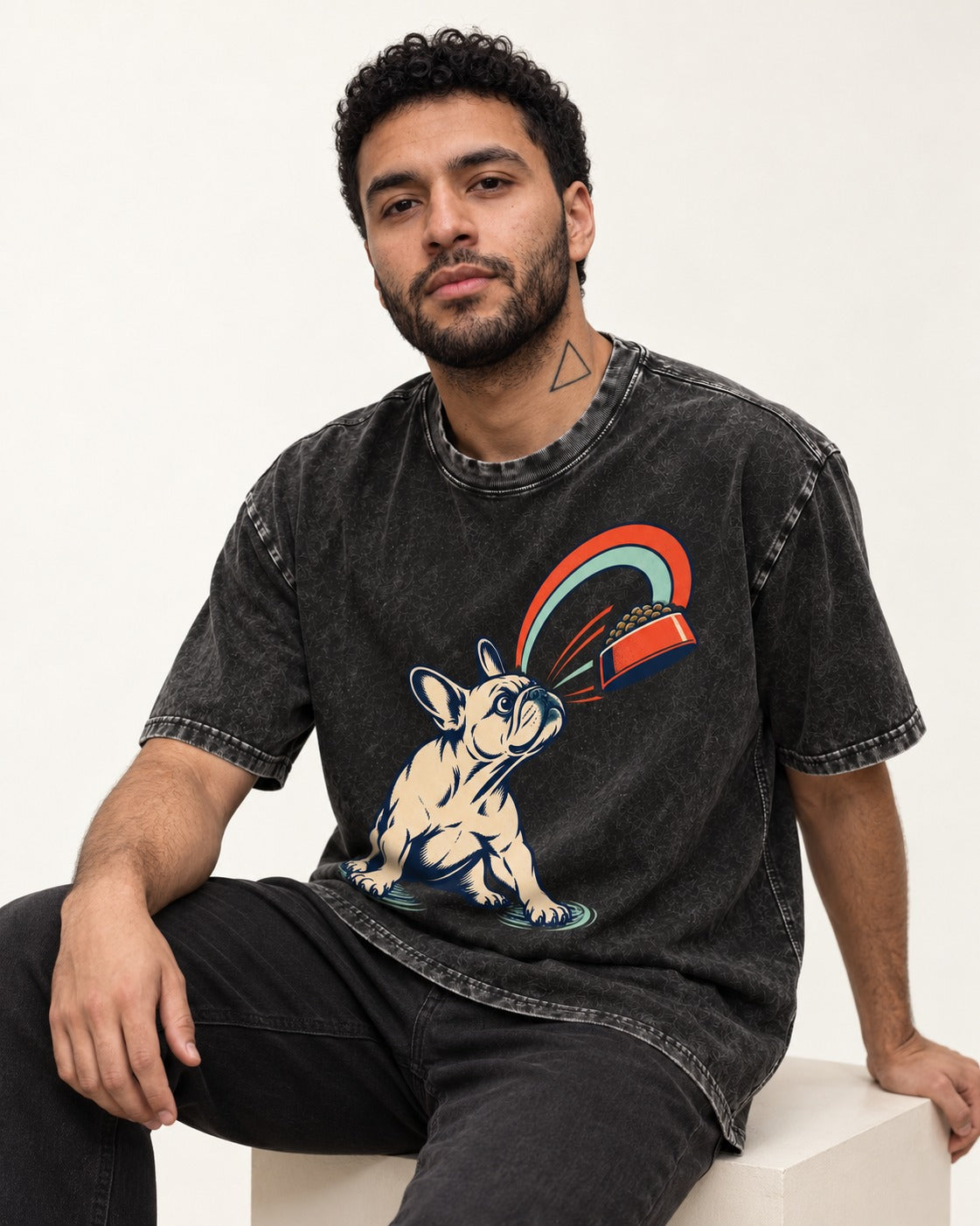 Frenchie Dinner Magnet Graphic Washed Tee in Black, worn by a seated model