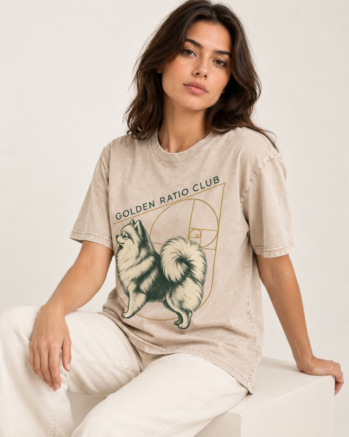 Pomeranian Golden Ratio Club Washed Tee in Apricot, worn by a seated model