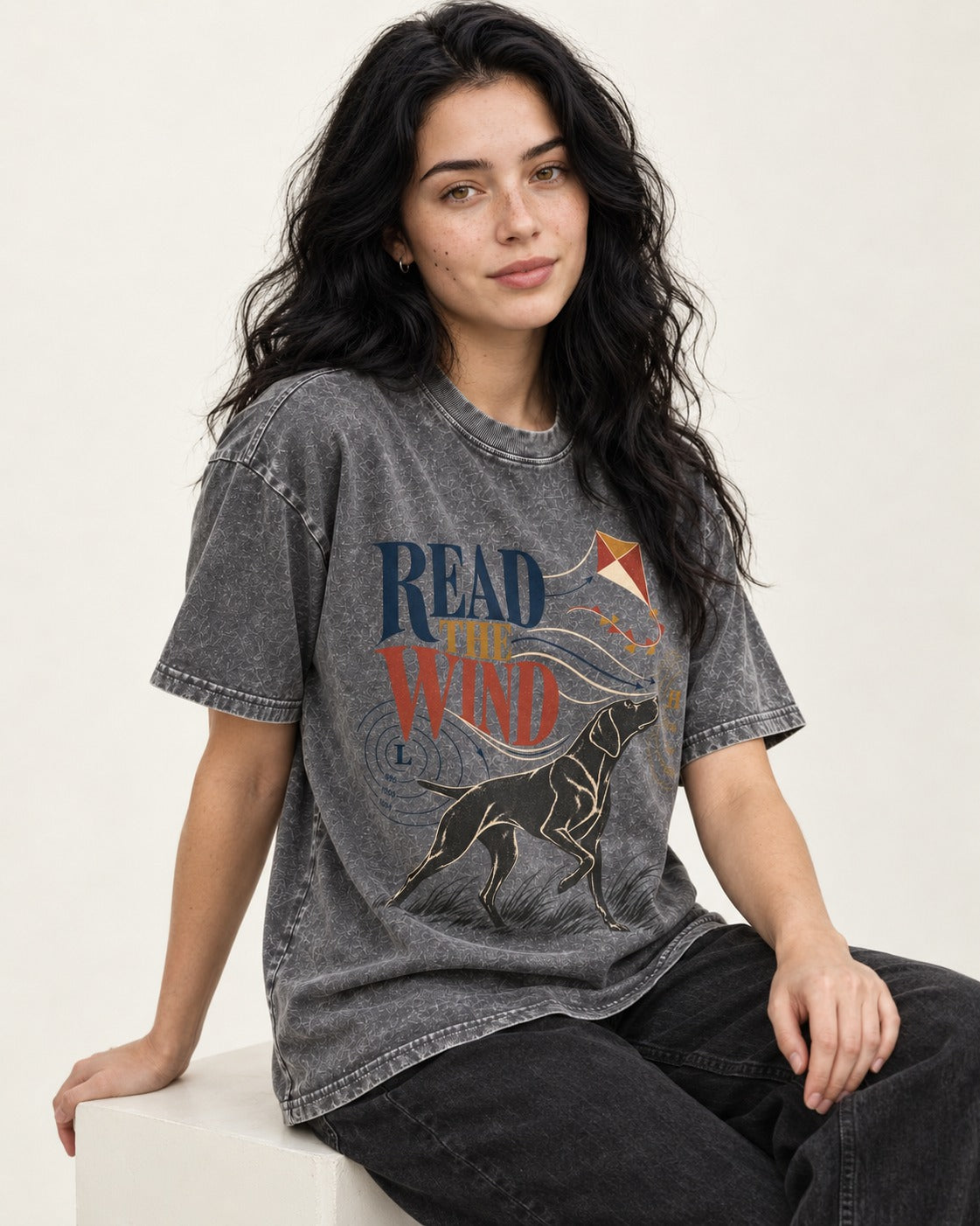 Read the Wind German Shorthaired Pointer Washed Tee in Gray, worn by a seated model