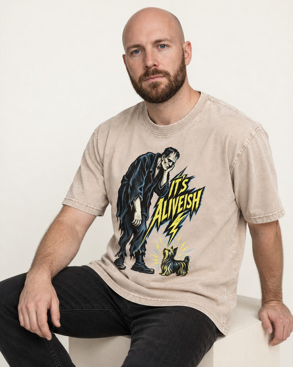 It's Aliveish Yorkshire Terrier Washed Tee in Apricot, worn by a seated model