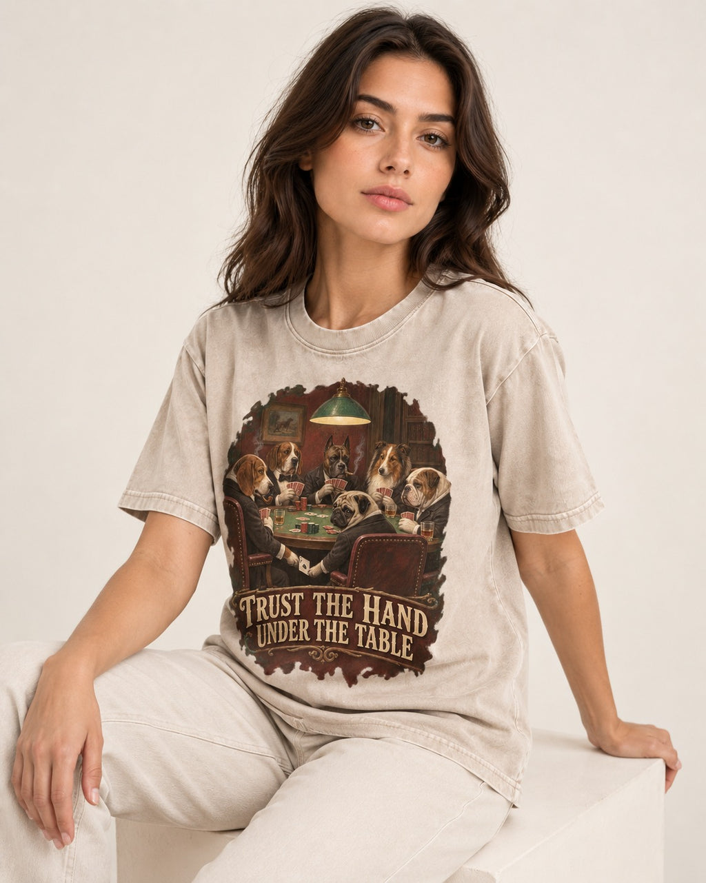 Pug Trust the Hand Under the Table Poker Graphic Washed Tee in Apricot, worn by a seated model