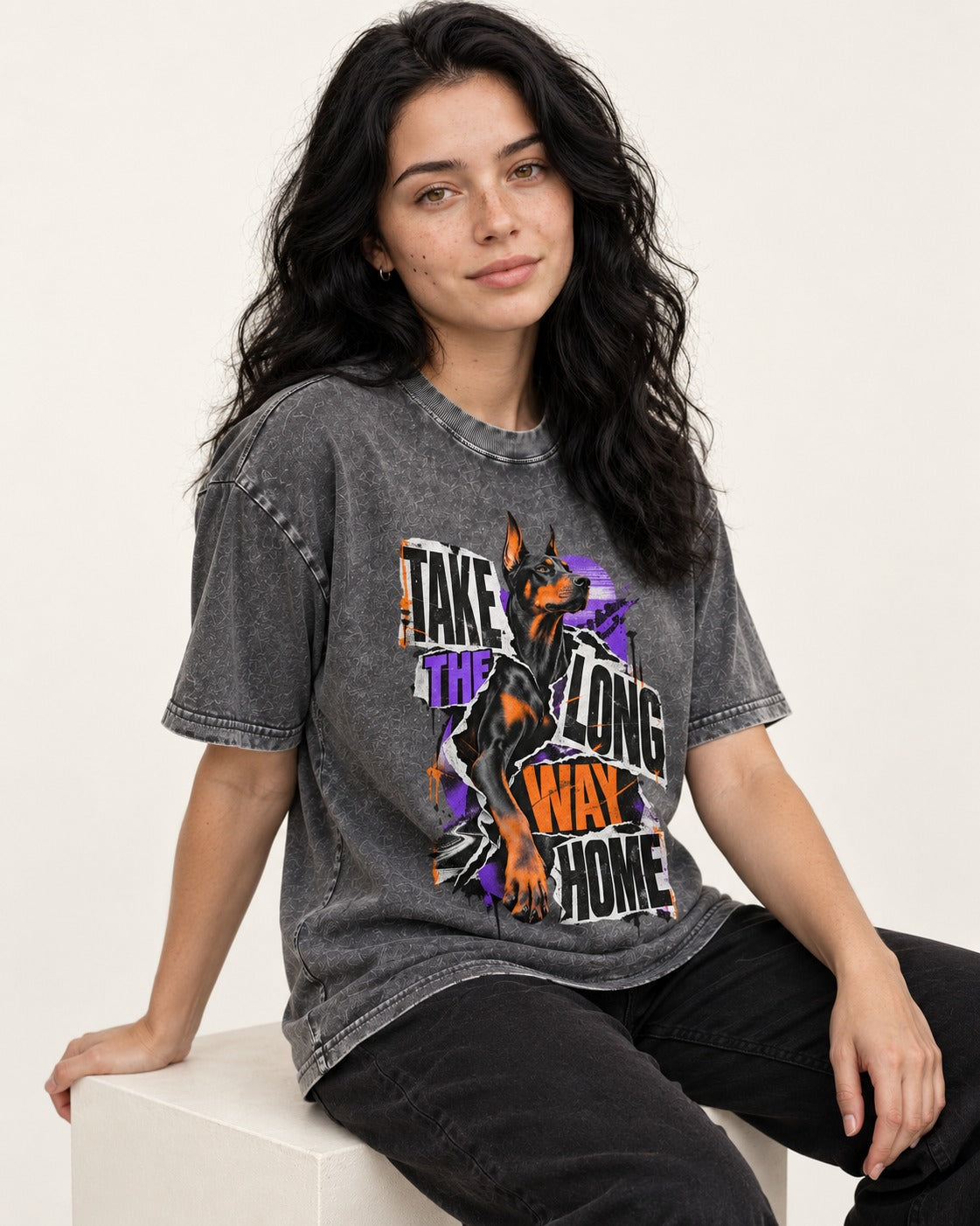 Doberman Long Way Home Washed Tee in Gray, worn by a seated model