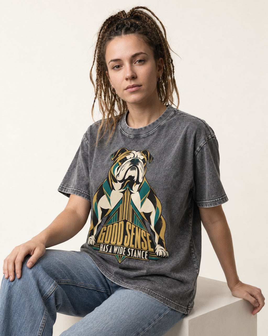 Good Sense Has a Wide Stance English Bulldog Graphic Washed Tee in Gray, worn by a seated model