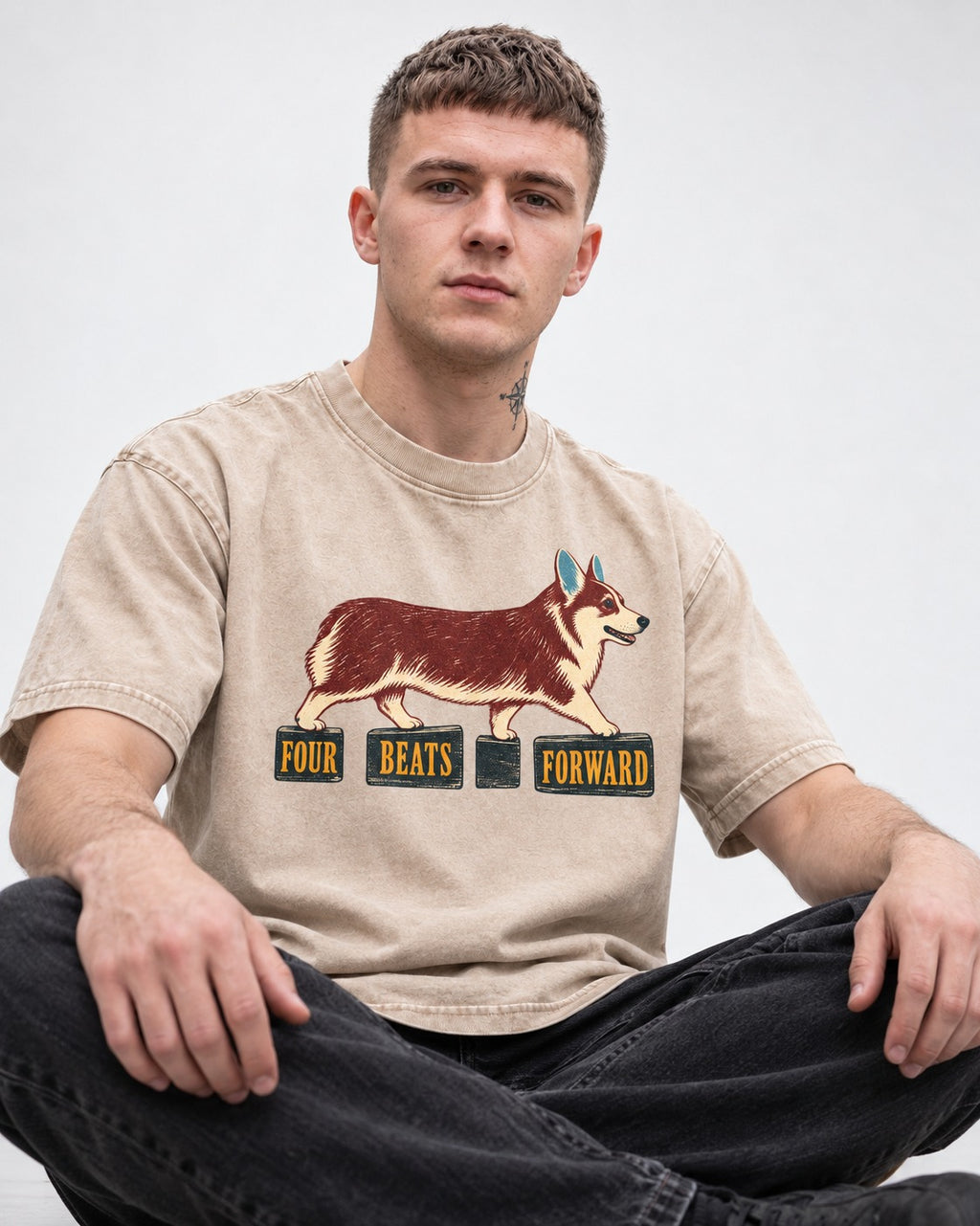 Corgi Four Beats Forward Washed Tee in Apricot, worn by a seated model