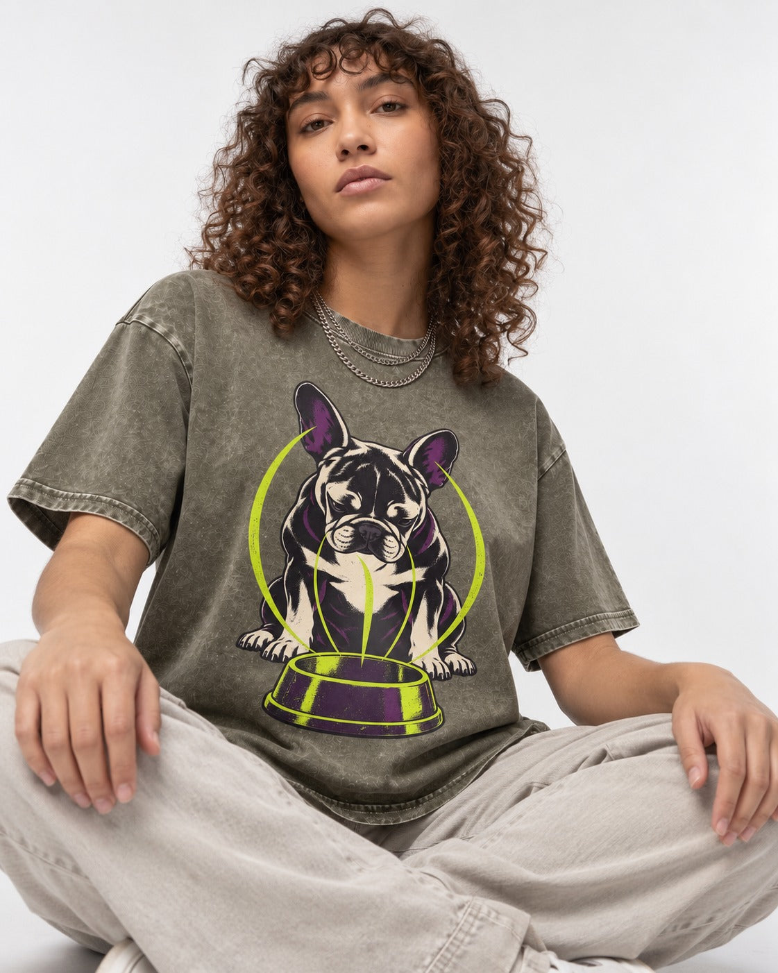 Frenchie Bowl Gravity Graphic Washed Tee in Army Green, worn by a seated model