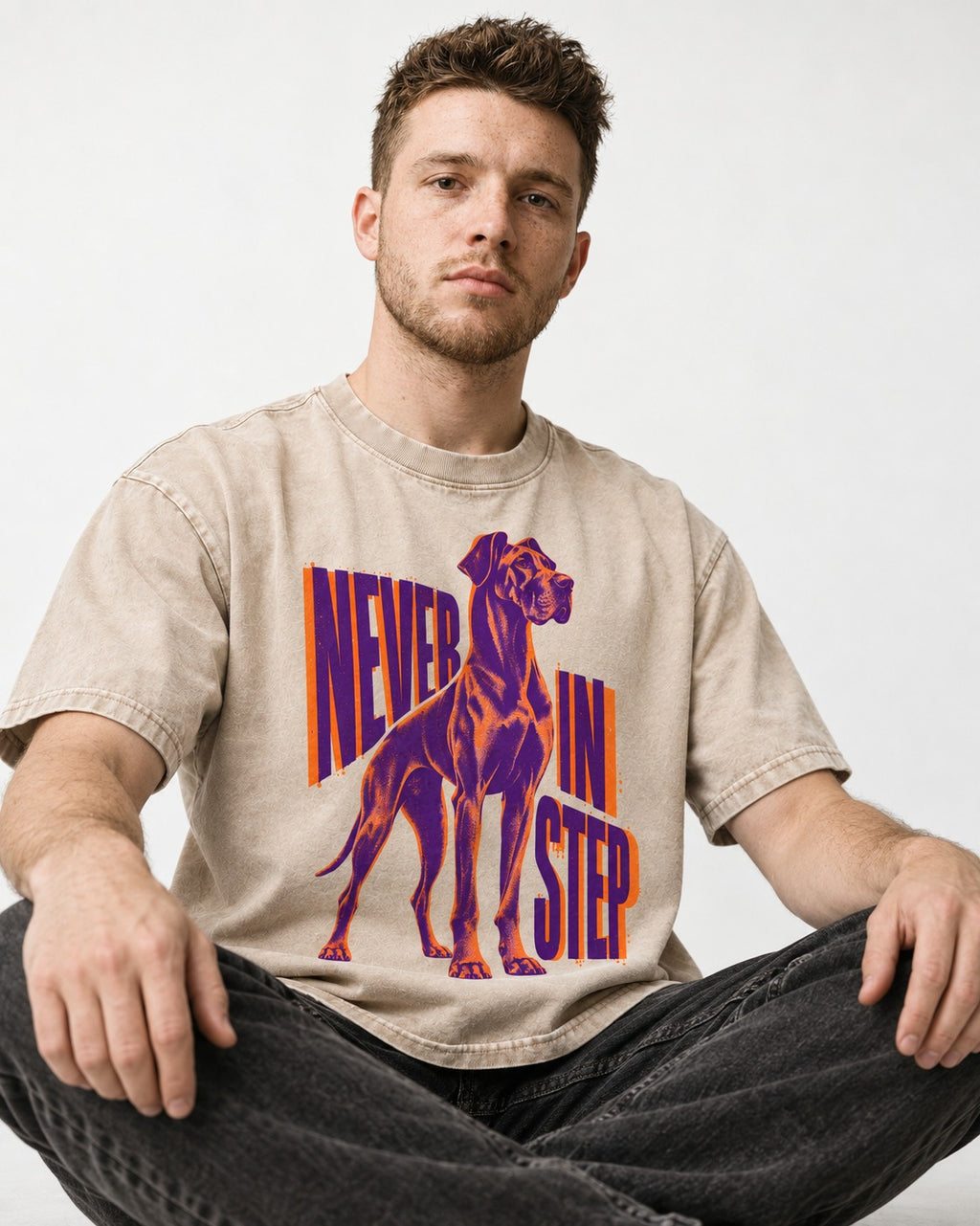 Great Dane Never in Step Standing Graphic Washed Tee in Apricot, worn by a seated model