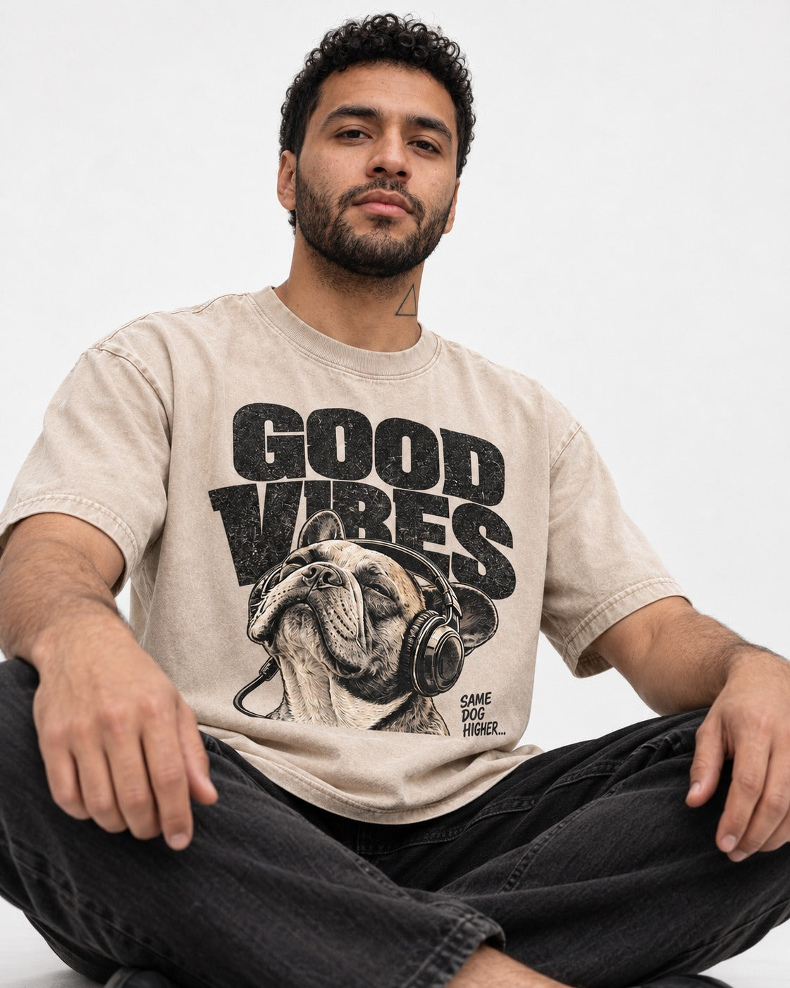 Frenchie Good Vibes Washed Tee in Apricot, worn by a seated model