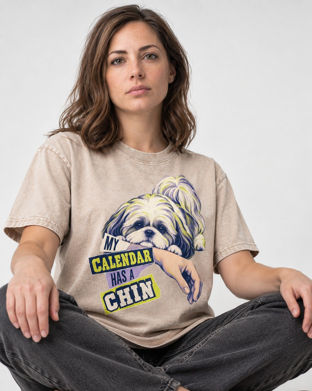 Shih Tzu My Calendar Has a Chin Arm Rest Graphic Washed Tee in Apricot, worn by a seated model
