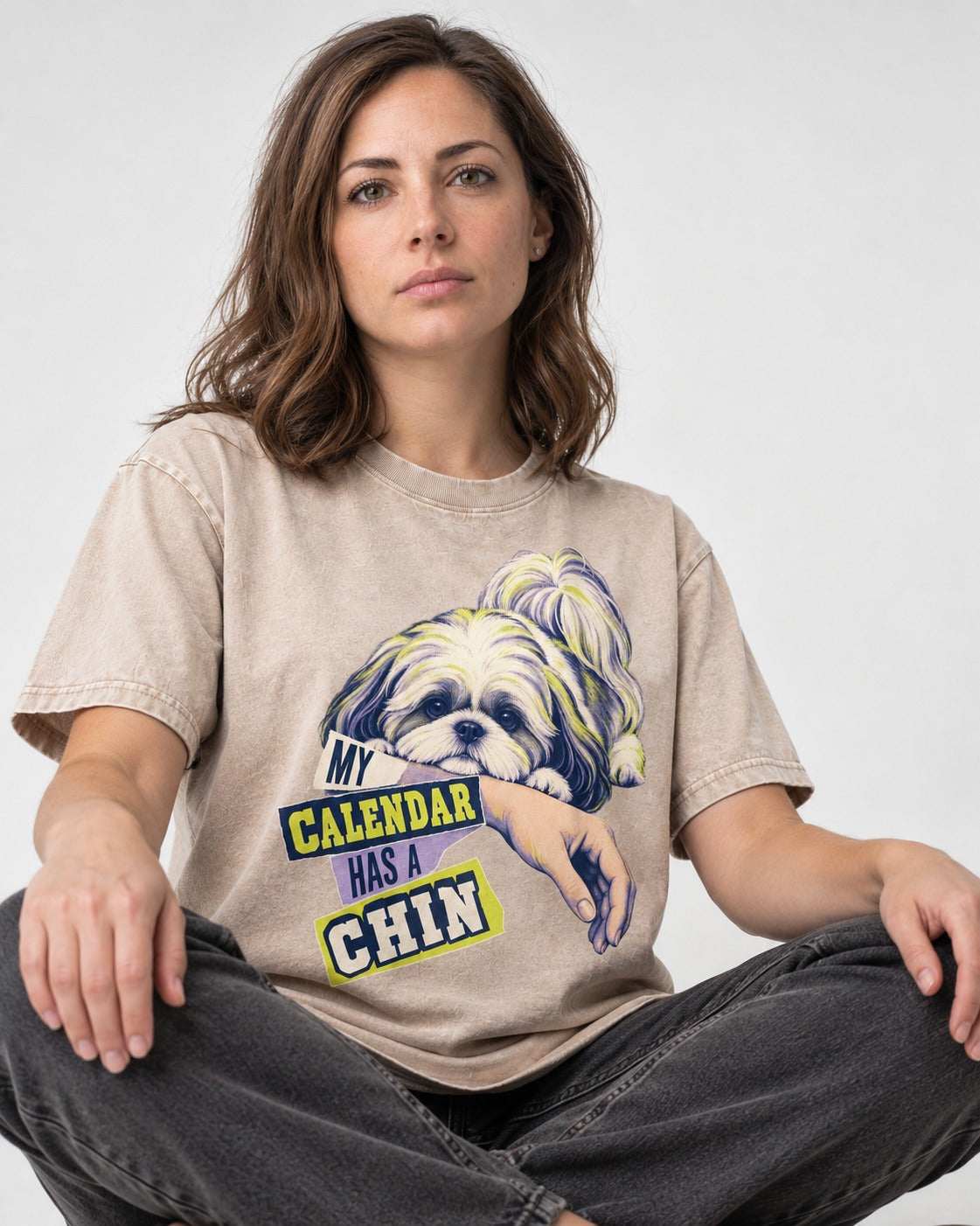 Shih Tzu My Calendar Has a Chin Arm Rest Graphic Washed Tee in Apricot, worn by a seated model