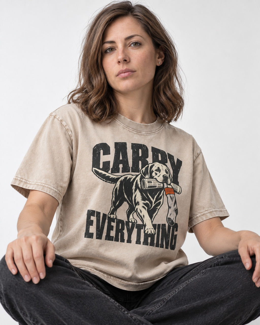 Carry Everything Labrador Retriever Washed Tee in Apricot, worn by a seated model