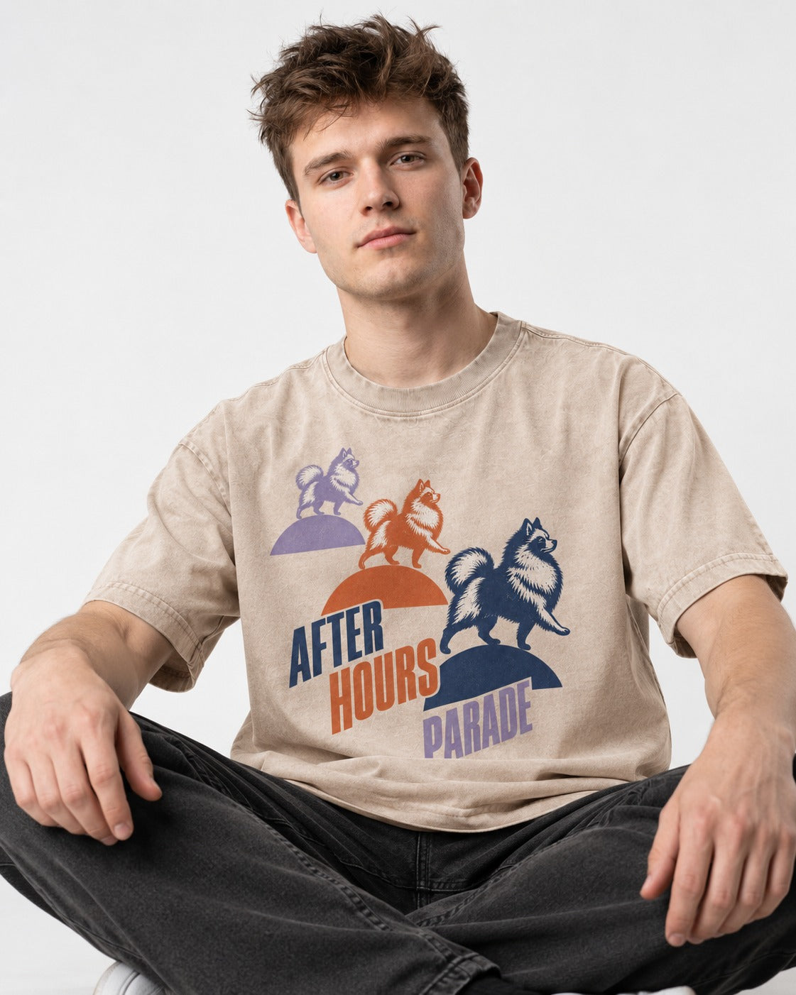 Pomeranian After Hours Parade Washed Tee in Apricot, worn by a seated model