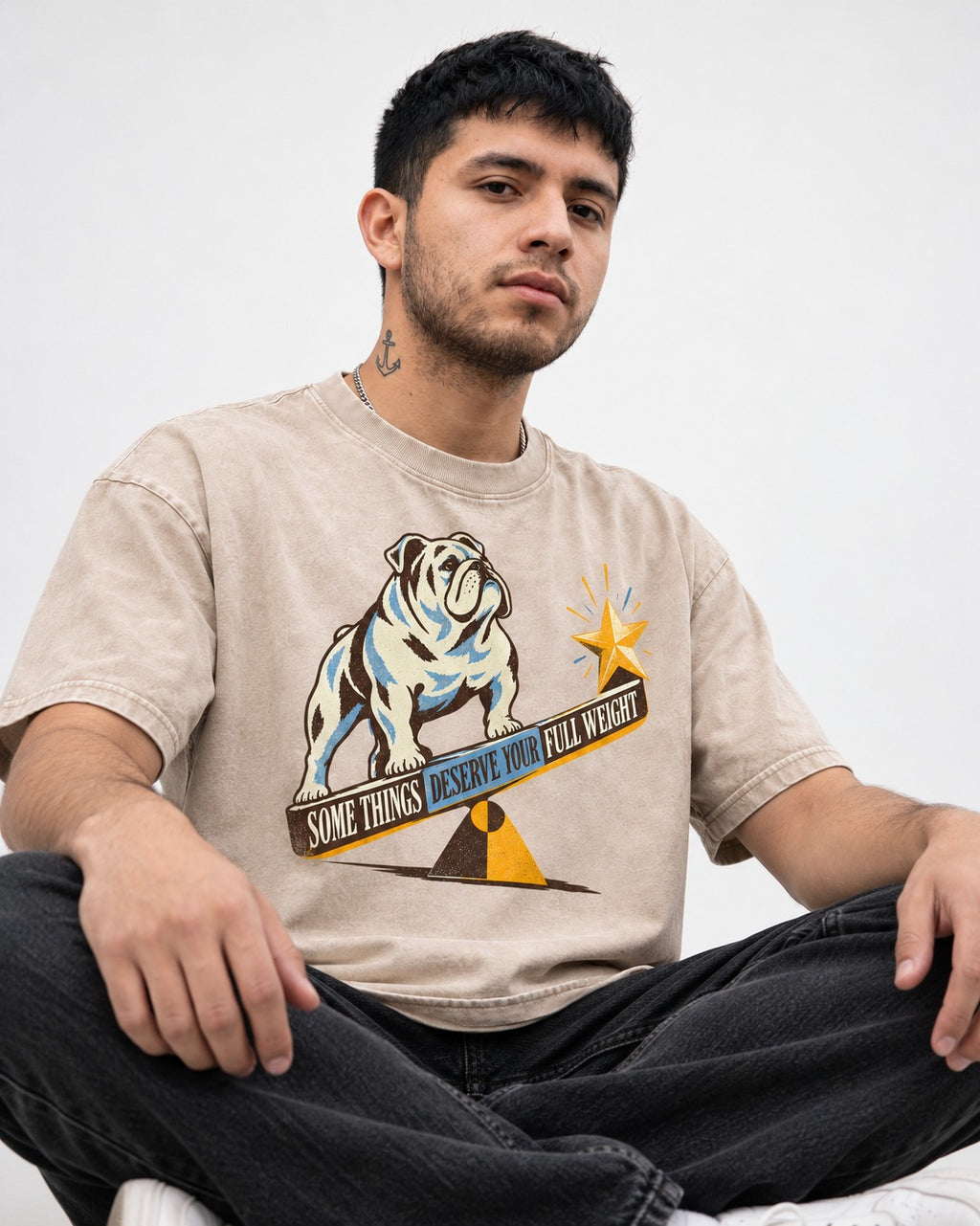 Some Things Deserve Your Full Weight English Bulldog Graphic Washed Tee in Apricot, worn by a seated model