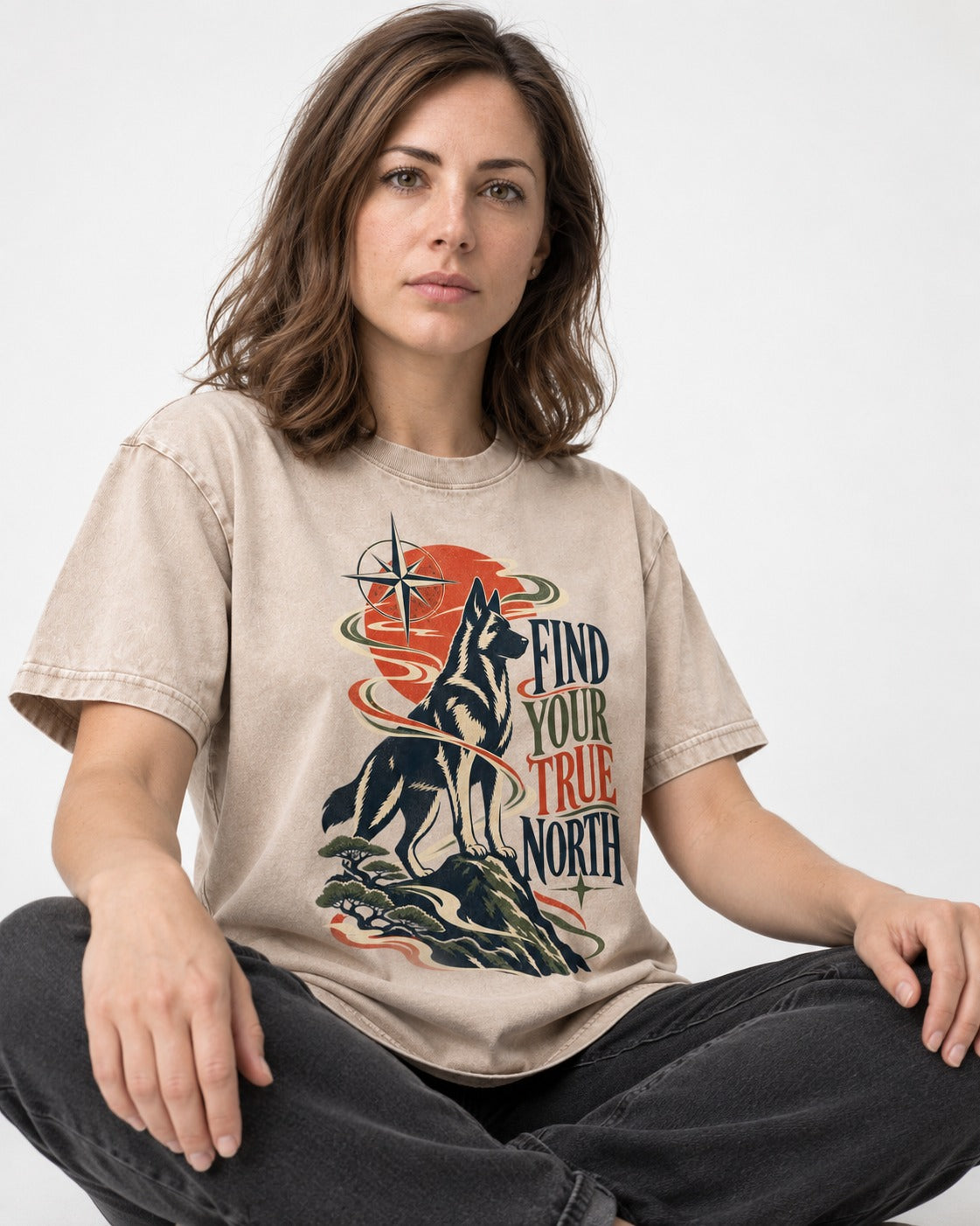 Find Your True North German Shepherd Dog Washed Tee in Apricot, worn by a seated model