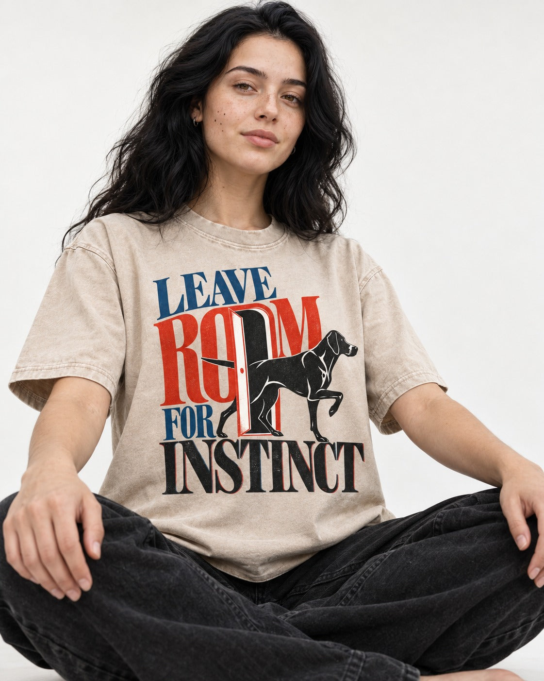 Leave Room for Instinct German Shorthaired Pointer Washed Tee in Apricot, worn by a seated model
