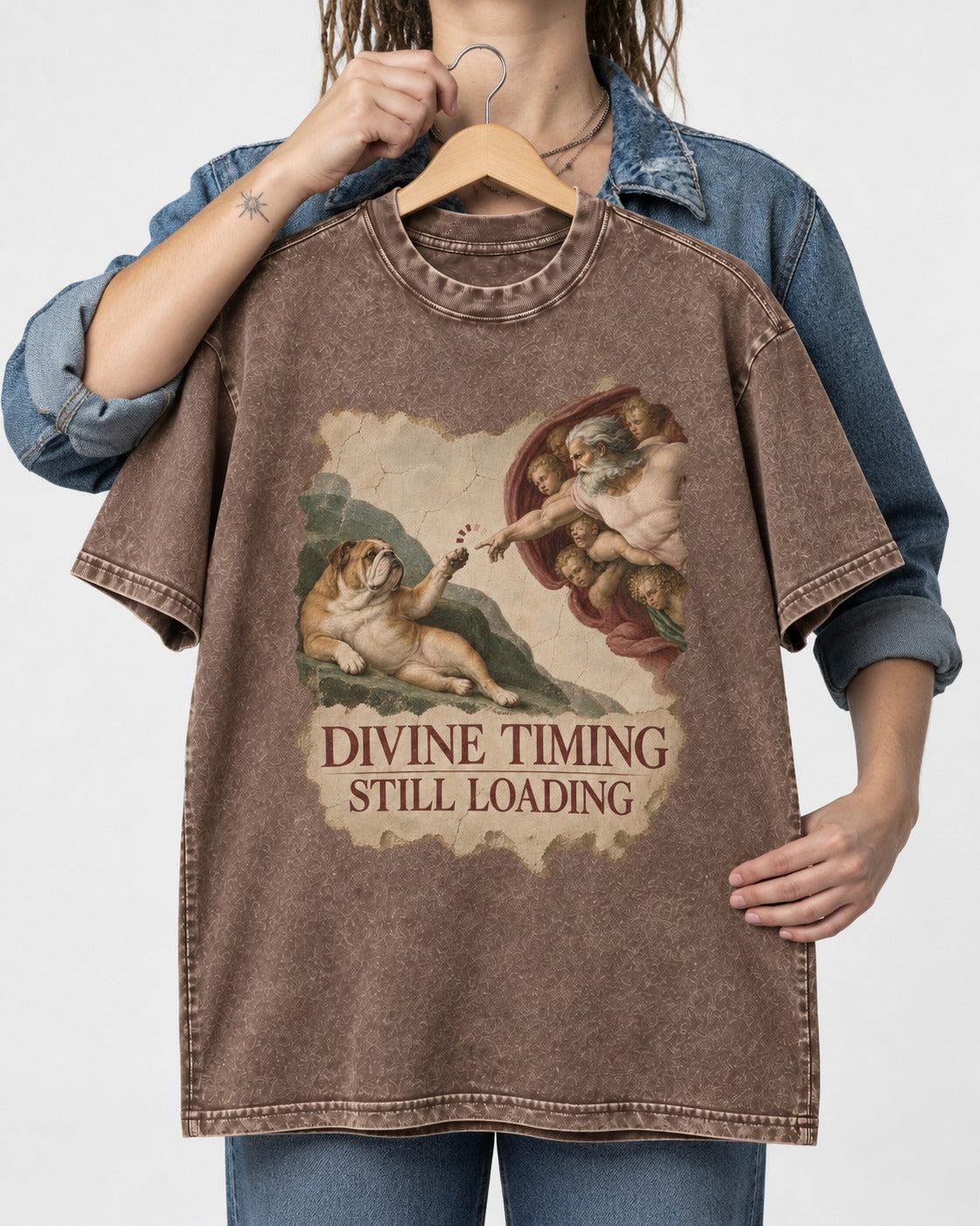 English Bulldog Divine Timing Still Loading Washed Tee in Coffee, held up on a hanger