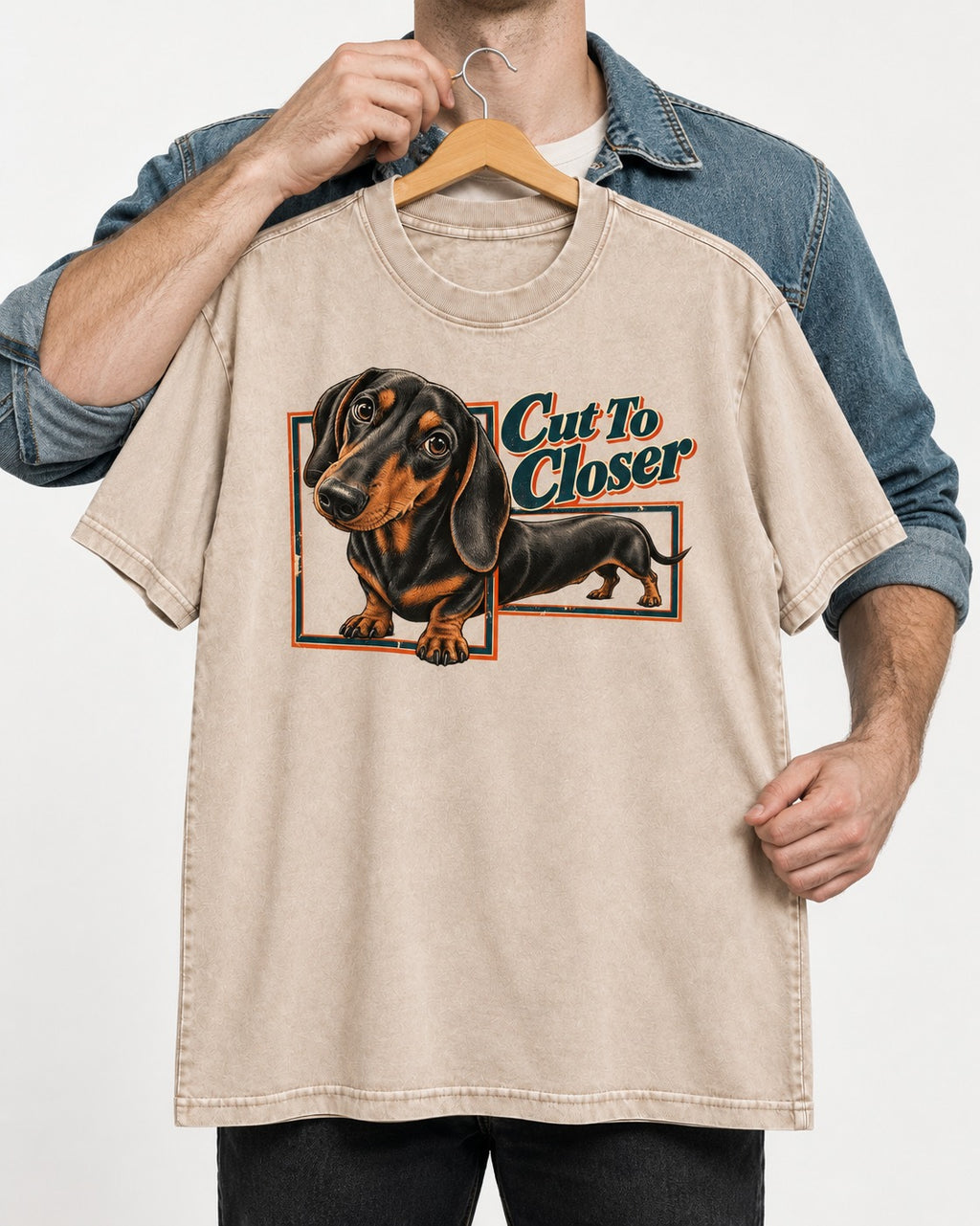 Dachshund Cut to Closer Washed Tee in Apricot, held up on a hanger