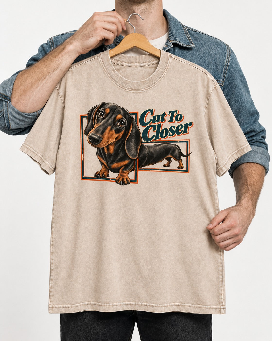 Dachshund Cut to Closer Washed Tee in Apricot, held up on a hanger