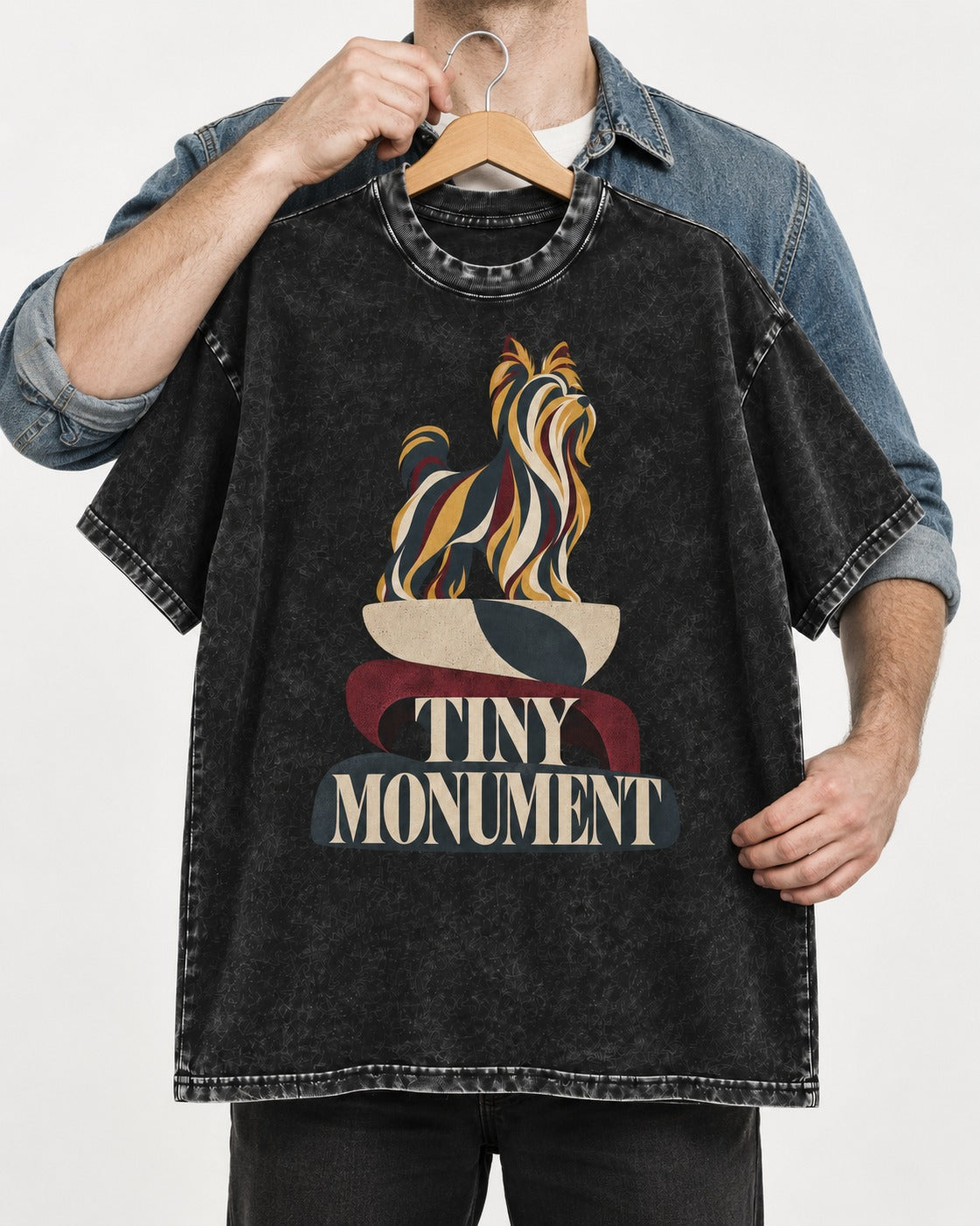 Yorkshire Terrier Tiny Monument Sculptural Plinth Graphic Washed Tee in Black, held up on a hanger