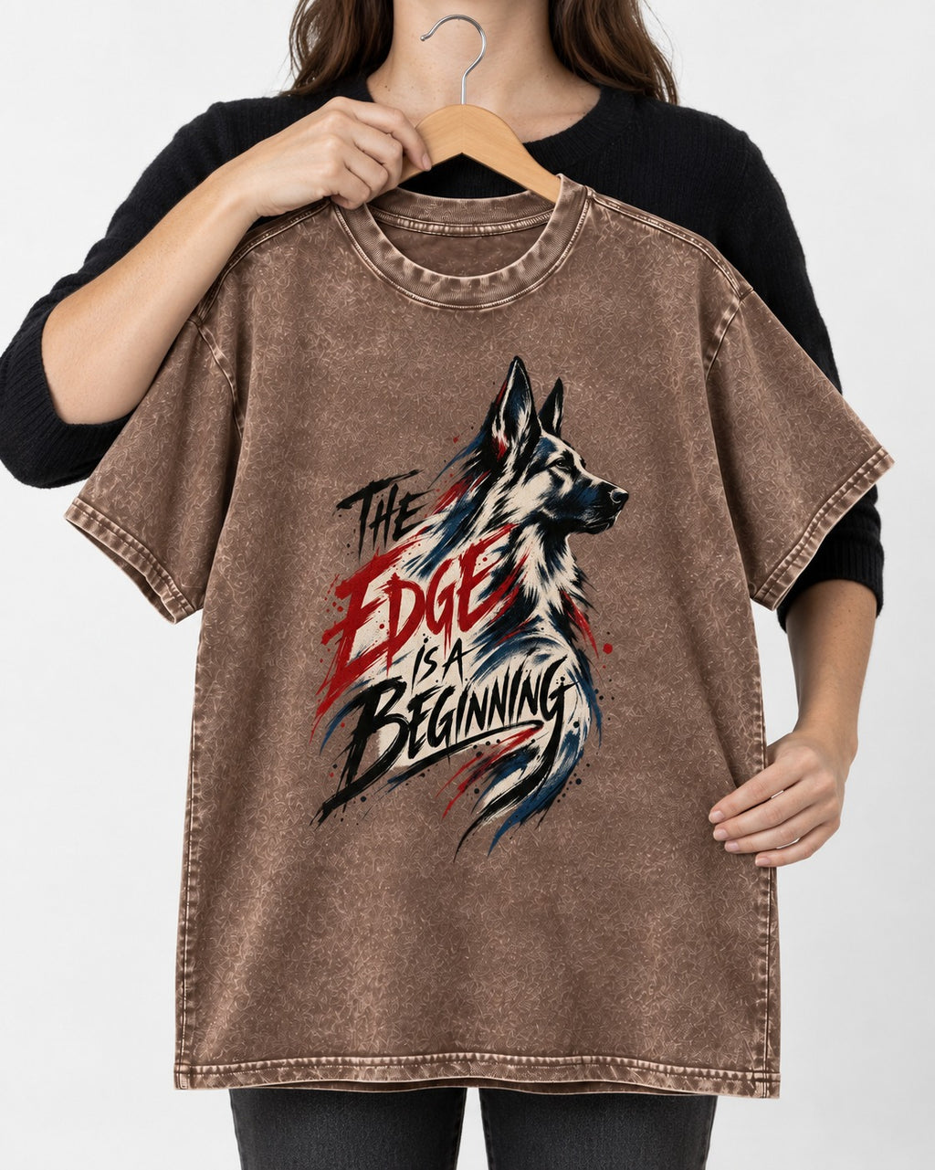 Edge Is a Beginning German Shepherd Dog Washed Tee in Coffee, held up on a hanger