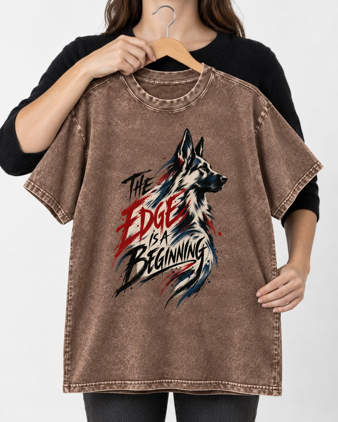 Edge Is a Beginning German Shepherd Dog Washed Tee in Coffee, held up on a hanger