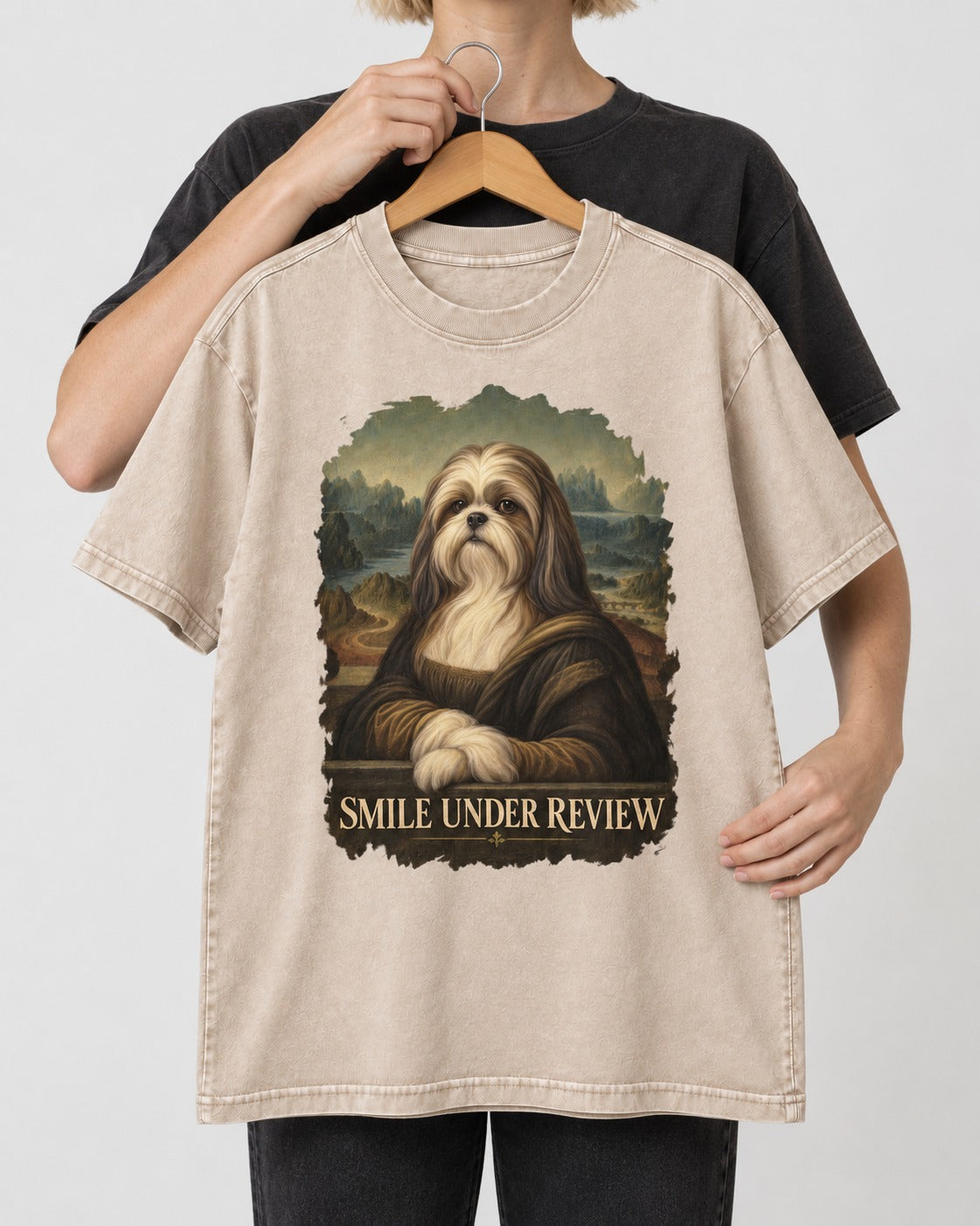 Shih Tzu Smile Under Review Old Master Portrait Graphic Washed Tee in Apricot, held up on a hanger