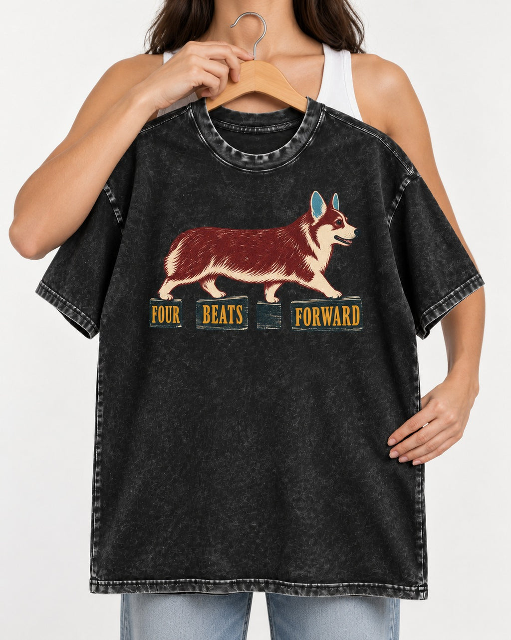 Corgi Four Beats Forward Washed Tee in Black, held up on a hanger