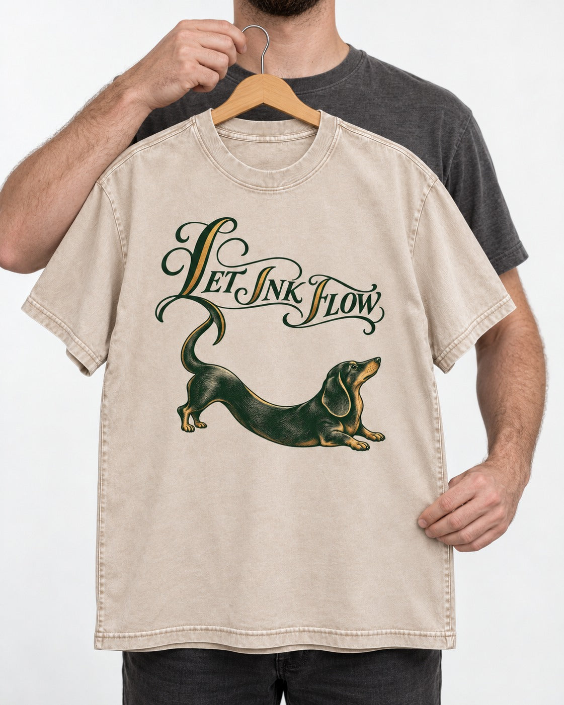 Let the Dachshund Ink Flow Washed Tee in Apricot, held up on a hanger