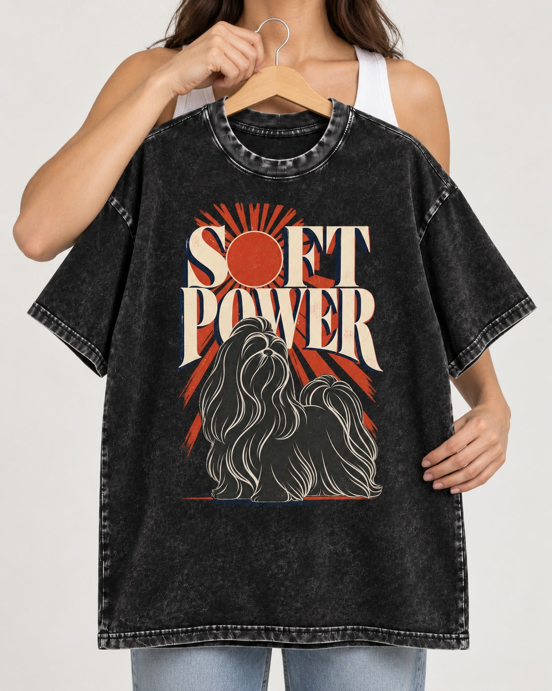 Shih Tzu Soft Power Sunburst Graphic Washed Tee in Black, held up on a hanger
