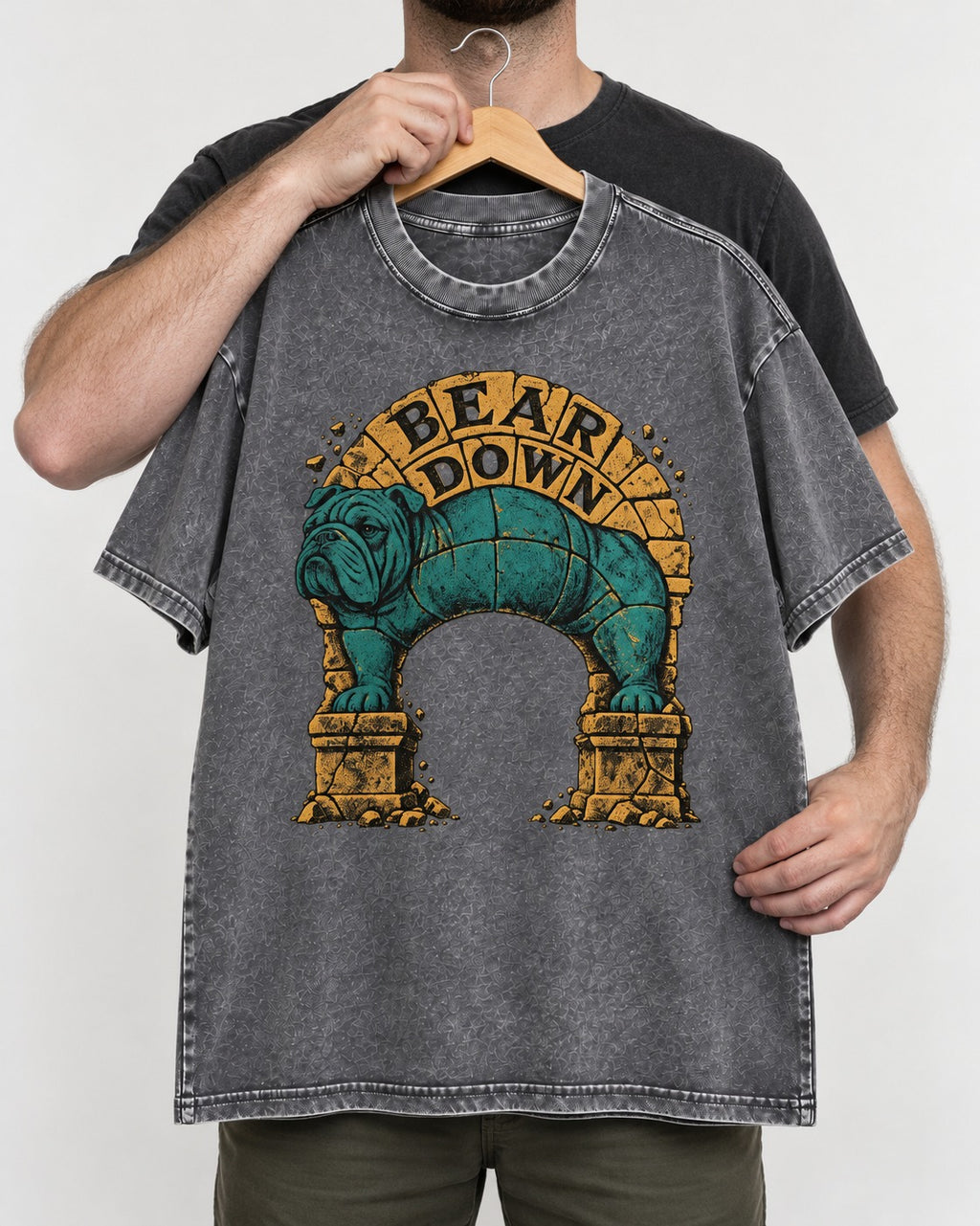 English Bulldog Bear Down Stone Arch Graphic Washed Tee in Gray, held up on a hanger