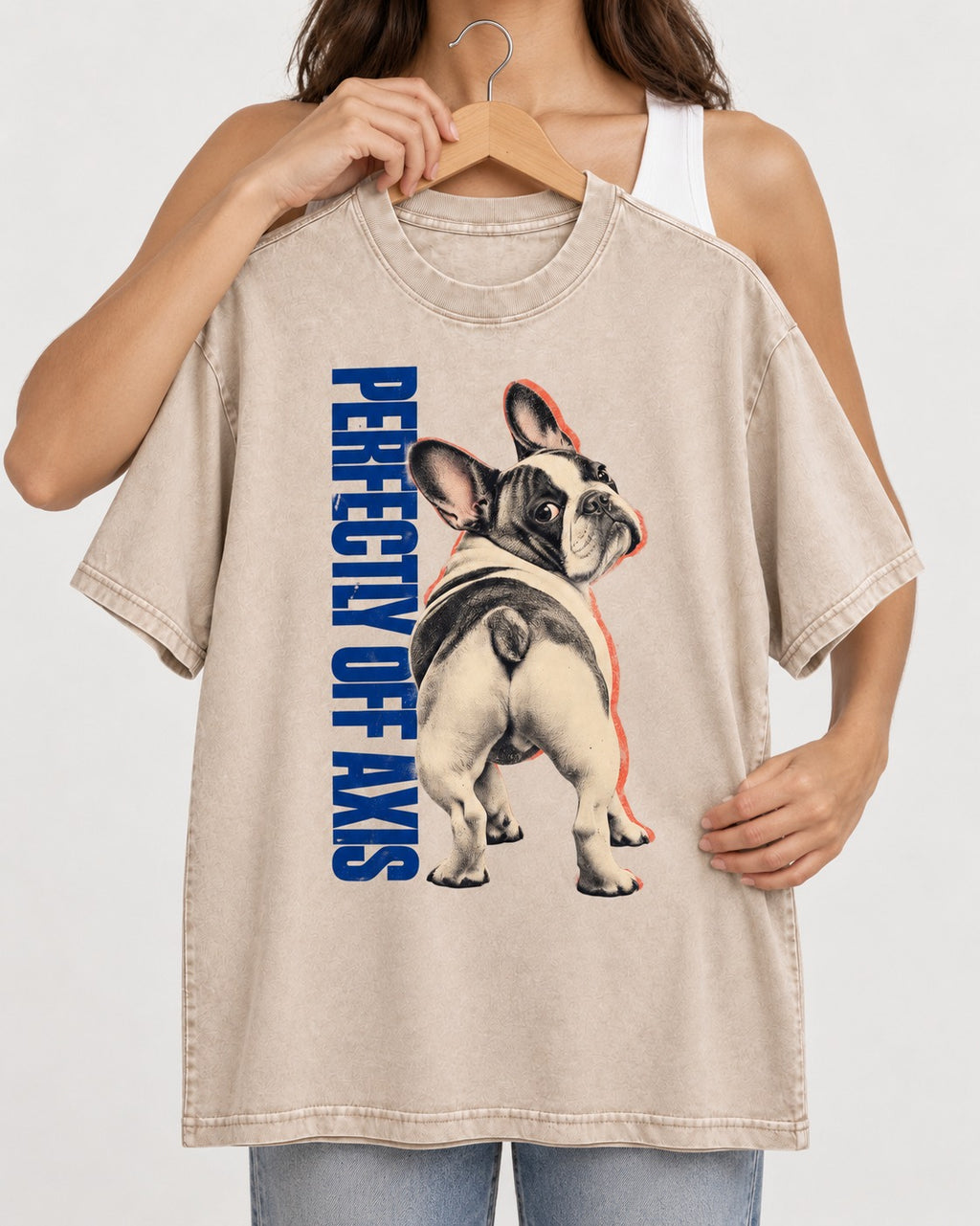 Perfectly Off Axis Frenchie Washed Tee in Apricot, held up on a hanger