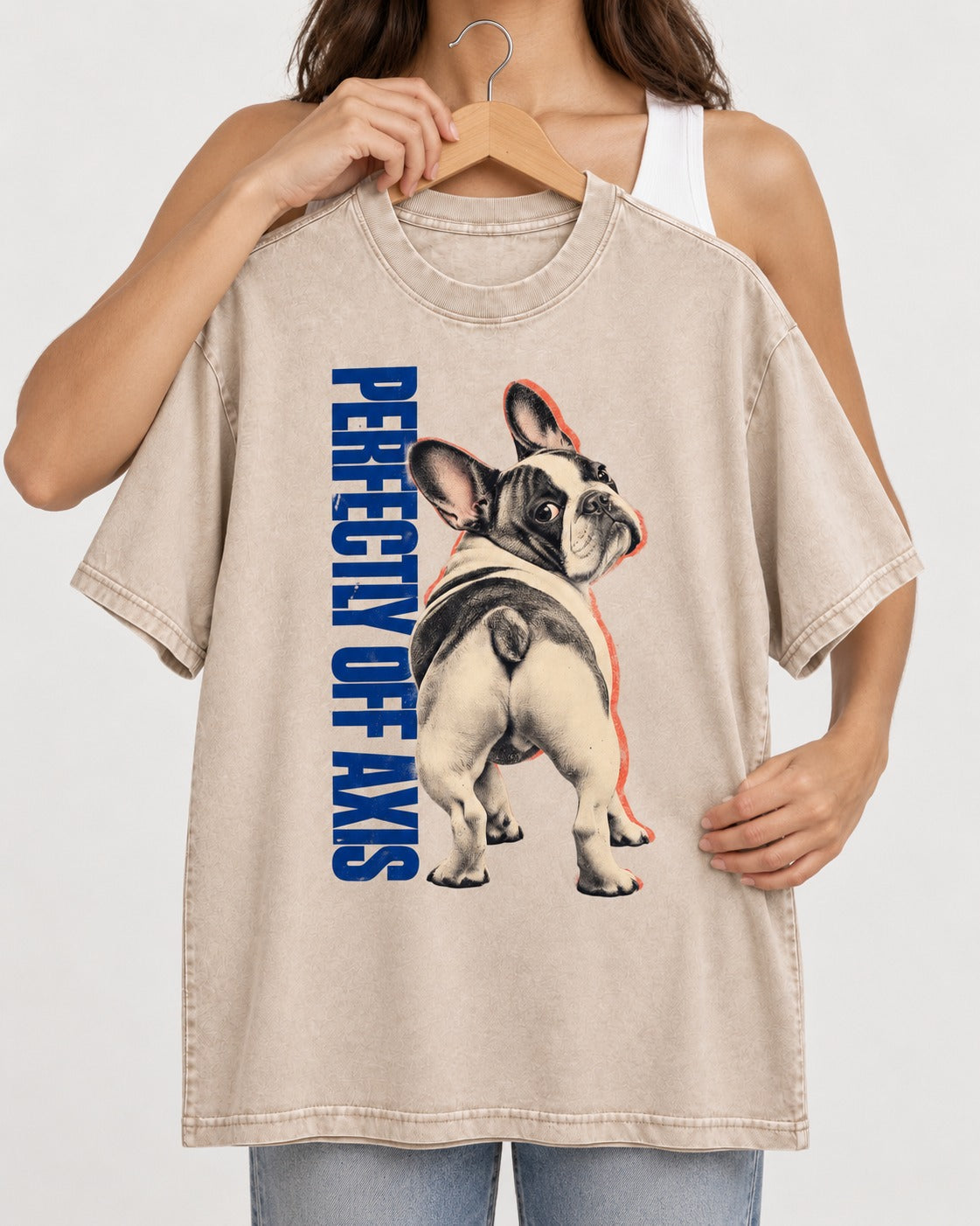 Perfectly Off Axis Frenchie Washed Tee in Apricot, held up on a hanger