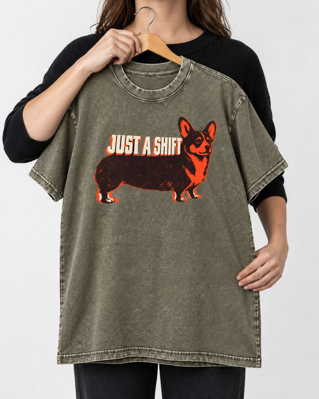 Corgi Just a Shift Typographic Graphic Washed Tee in Army Green, held up on a hanger