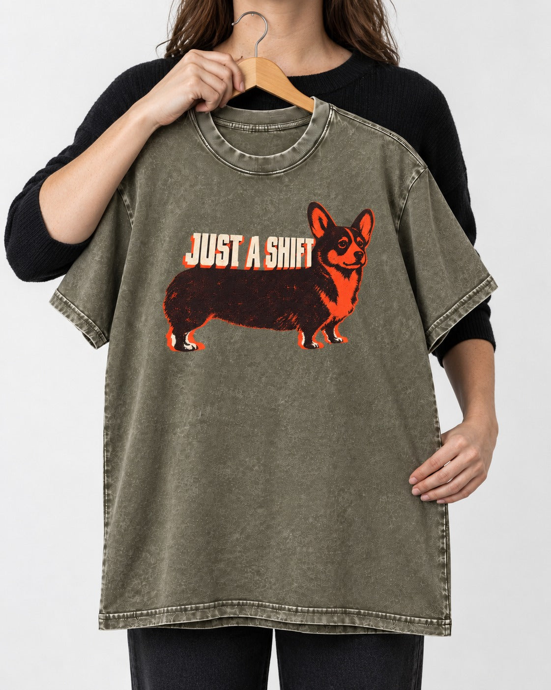 Corgi Just a Shift Typographic Graphic Washed Tee in Army Green, held up on a hanger