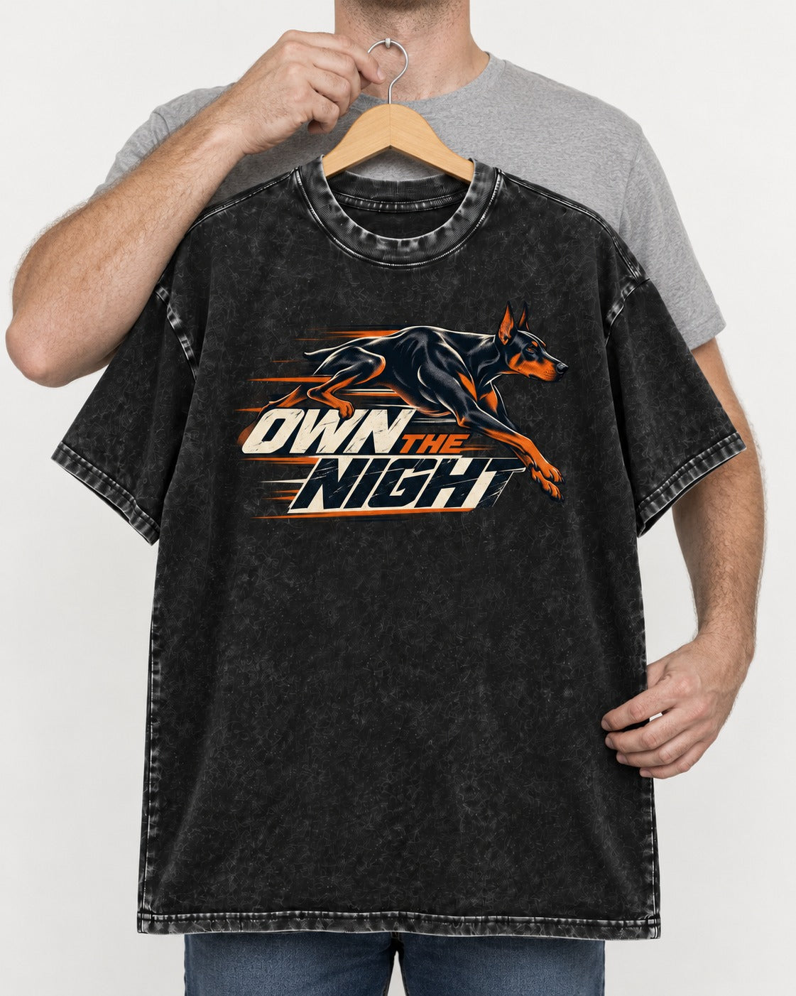 Doberman Own the Night Speed Graphic Washed Tee in Black, held up on a hanger