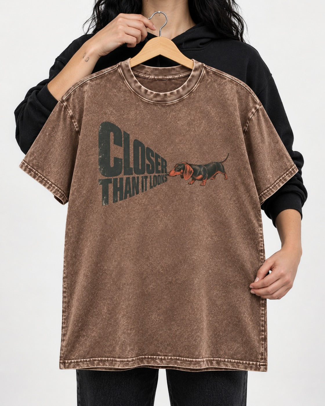 Dachshund Closer Than It Looks Washed Tee in Coffee, held up on a hanger
